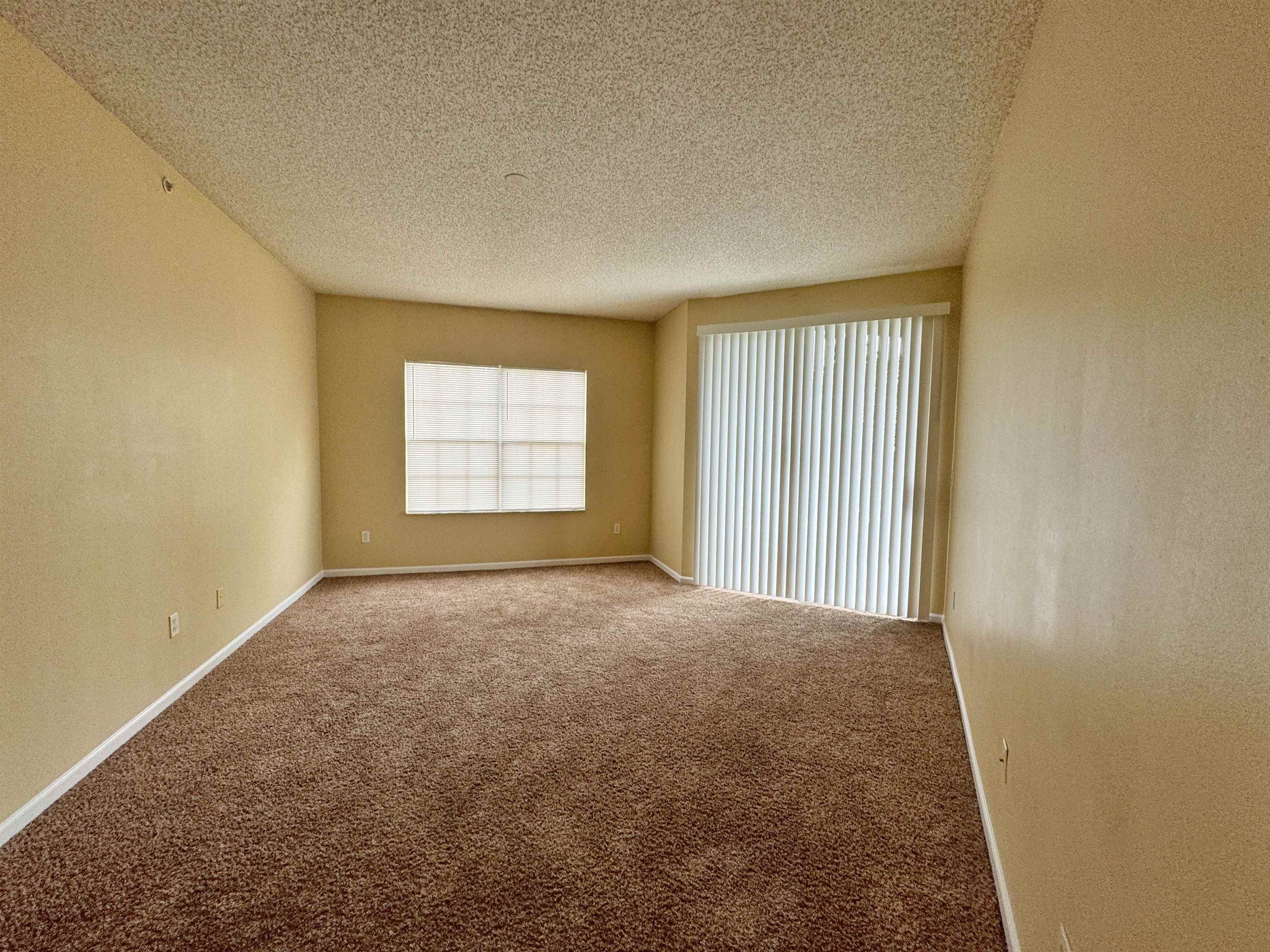 4035 Grande Vista Boulevard, Unit 201 St. Augustine, FL 32084 - Photo 4 of 28 an empty room with a window