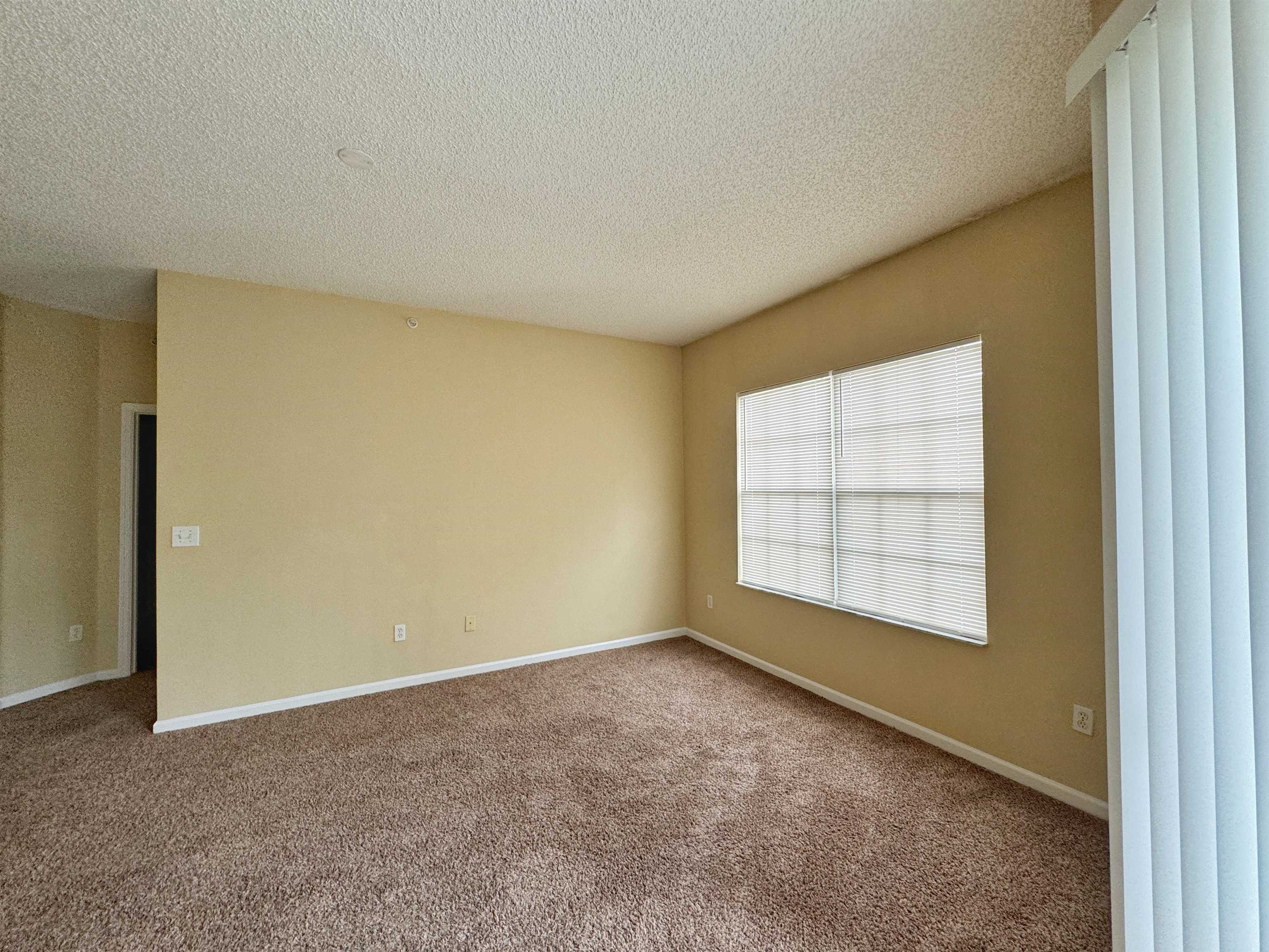 4035 Grande Vista Boulevard, Unit 201 St. Augustine, FL 32084 - Photo 6 of 28 an empty room with a window