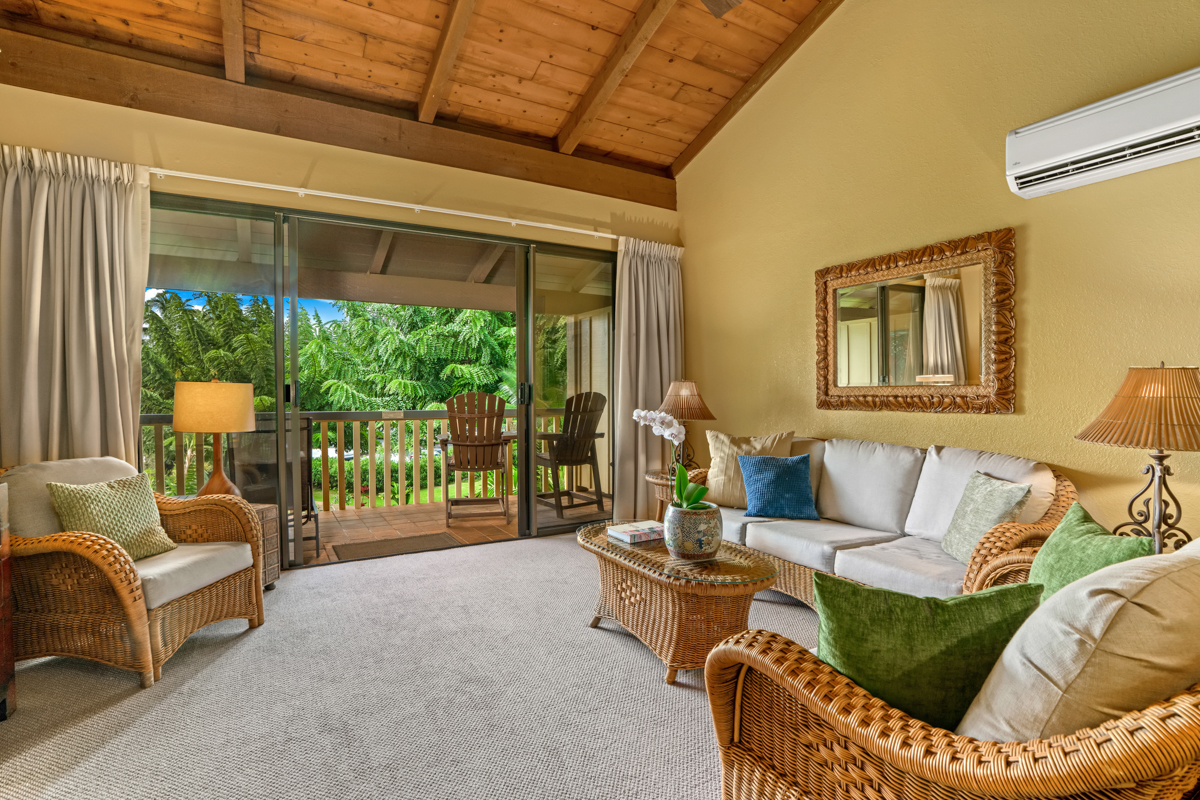 1870 Hoone Road, Unit 602 Koloa, HI 96756 - Photo 7 of 26 a living room with furniture and a floor to ceiling window
