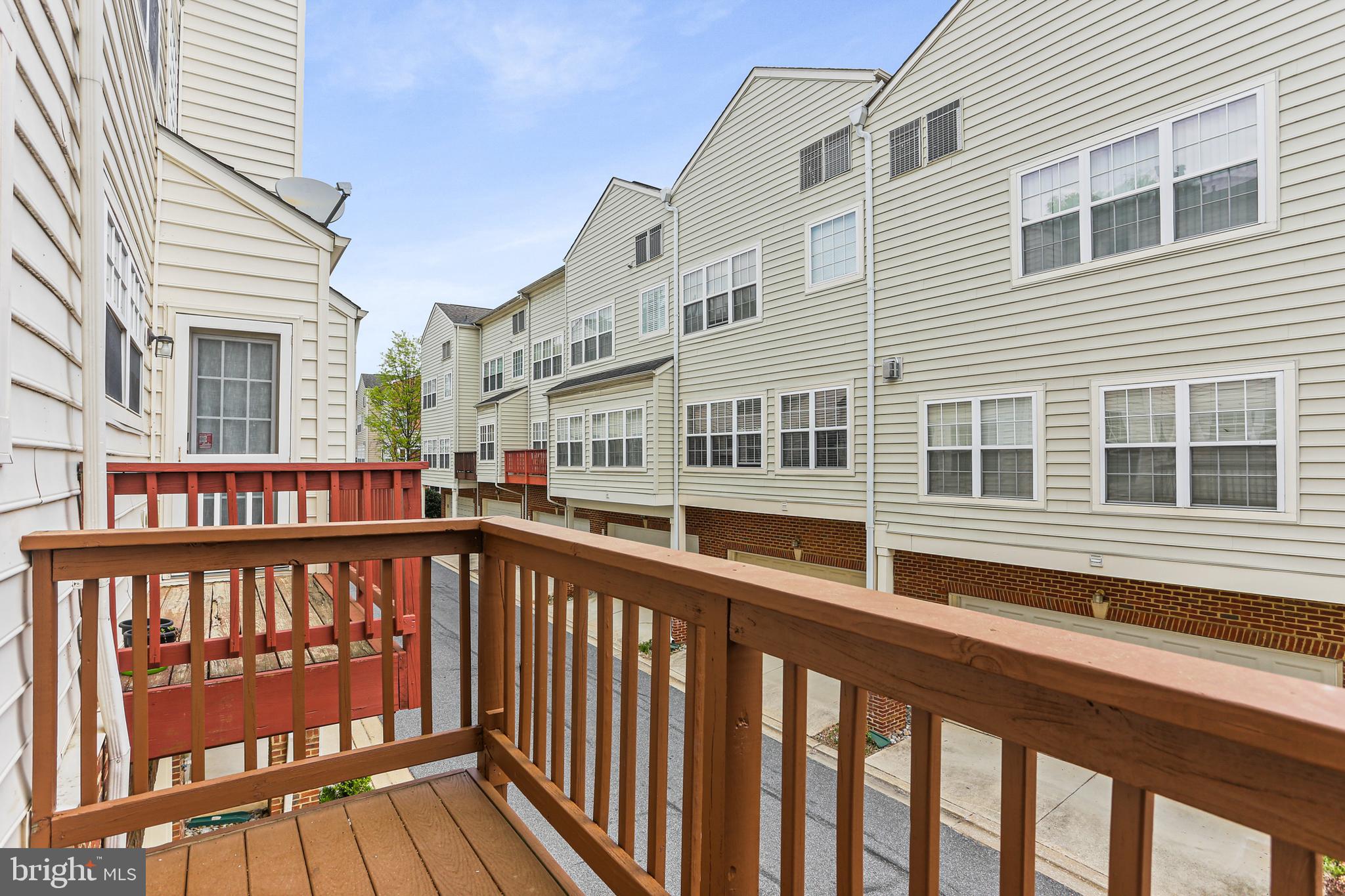 10232 Rutland Round Road, Unit 24 Columbia, MD 21044 - Photo 28 of 31 a view of a brick building from a balcony