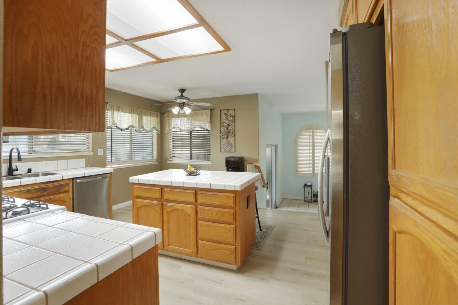 1725 Mark Mead Lane Modesto, CA 95356 - Photo 22 of 52 a kitchen with a stove a sink and a refrigerator
