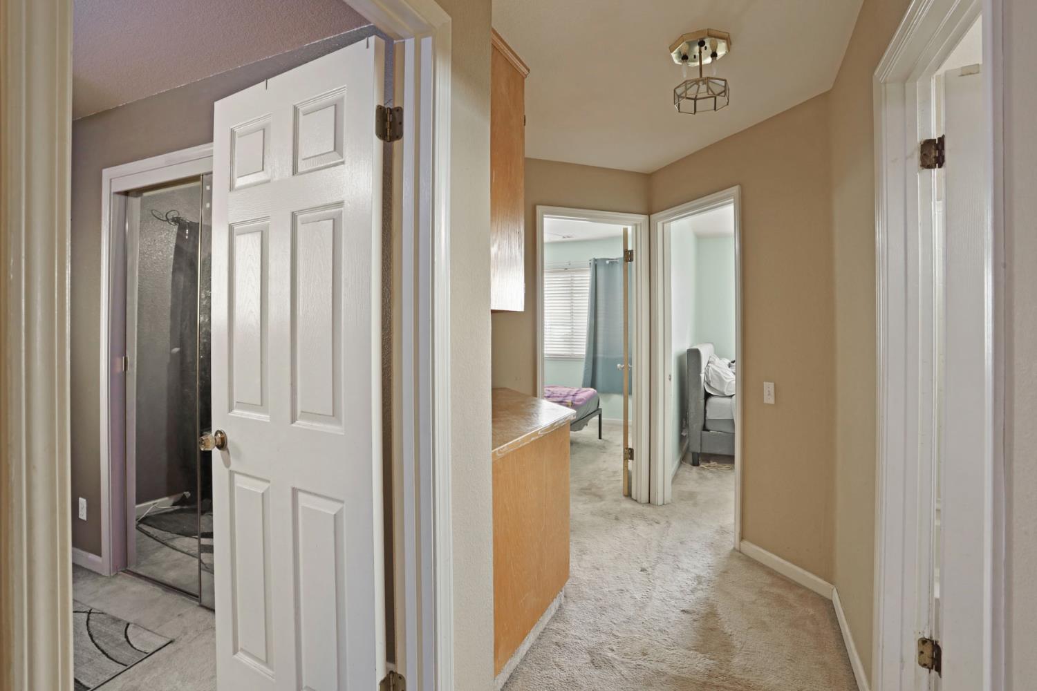 1725 Mark Mead Lane Modesto, CA 95356 - Photo 26 of 52 a view of a hallway with closet and a livingroom view