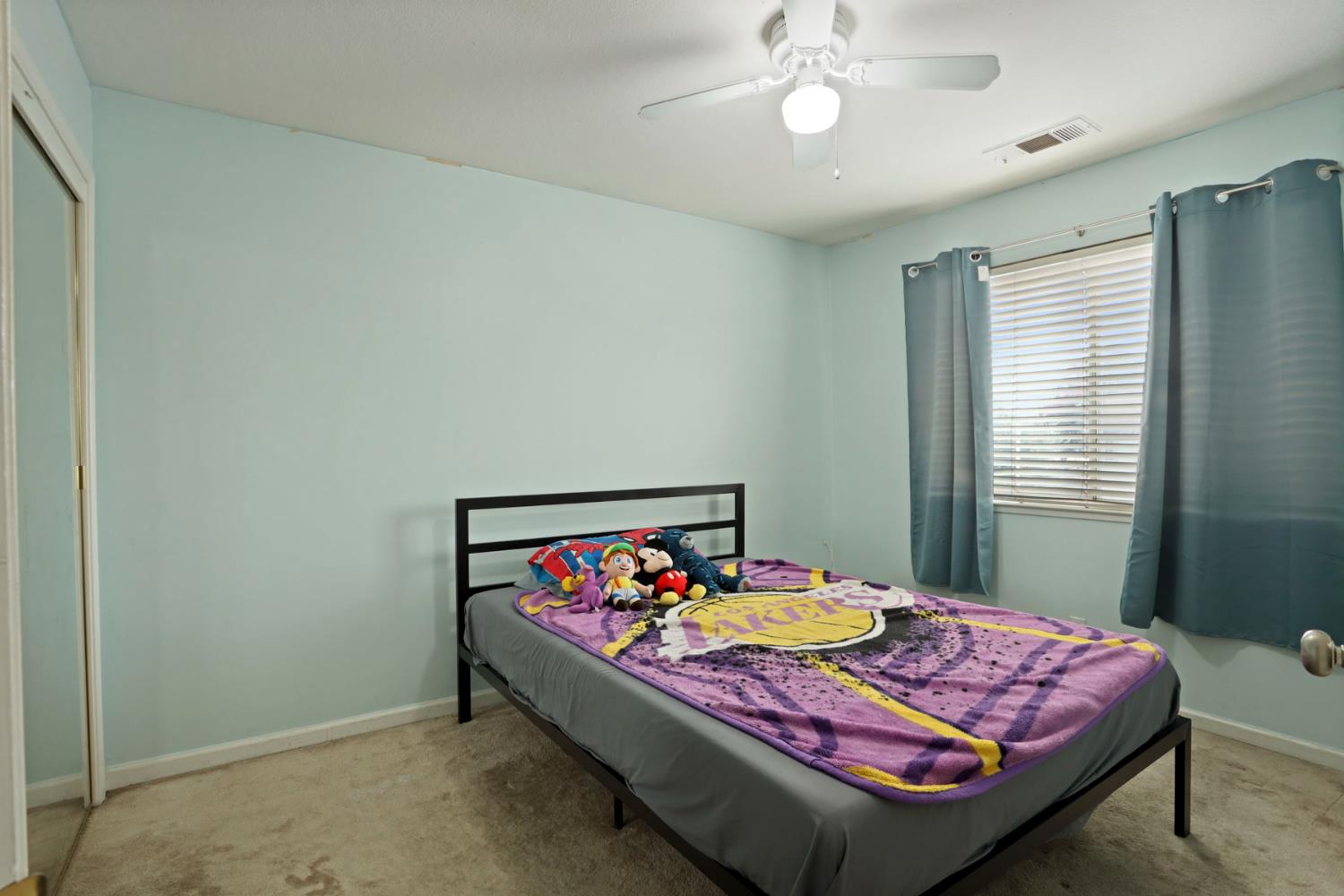 1725 Mark Mead Lane Modesto, CA 95356 - Photo 31 of 52 a bed room with furniture and window