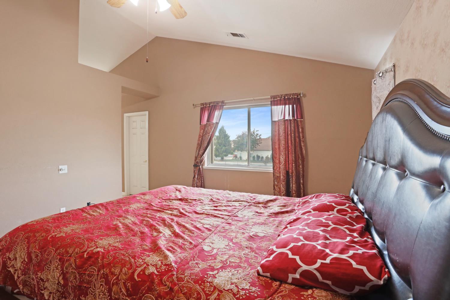 1725 Mark Mead Lane Modesto, CA 95356 - Photo 33 of 52 a bedroom with a bed and a window