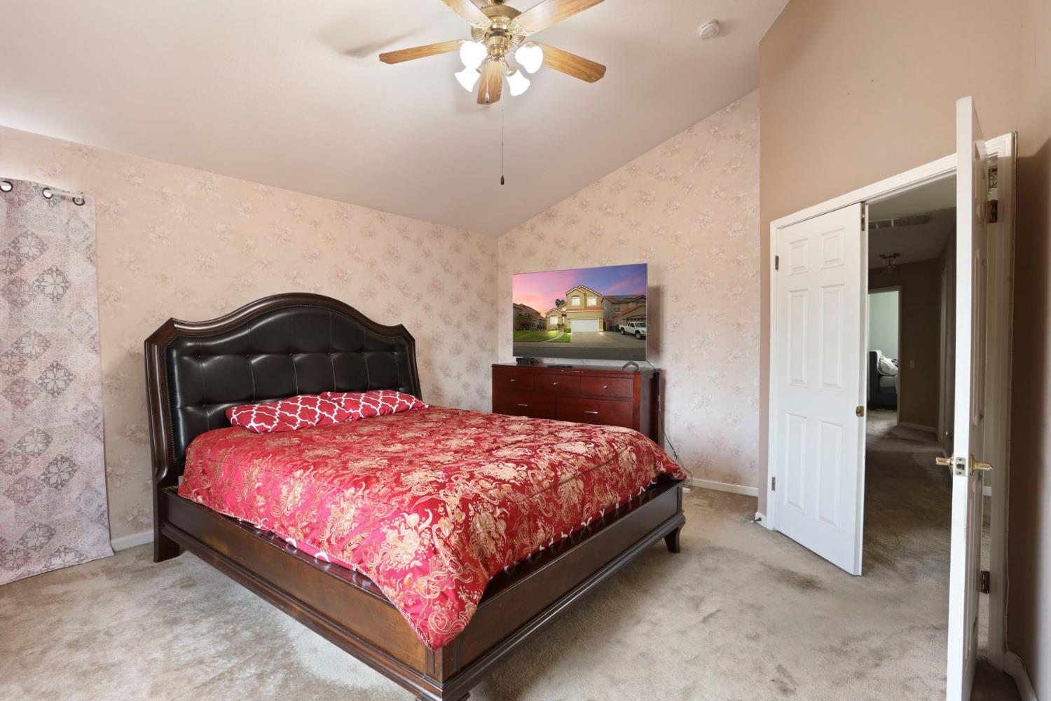 1725 Mark Mead Lane Modesto, CA 95356 - Photo 36 of 52 a bedroom with a bed and a dresser