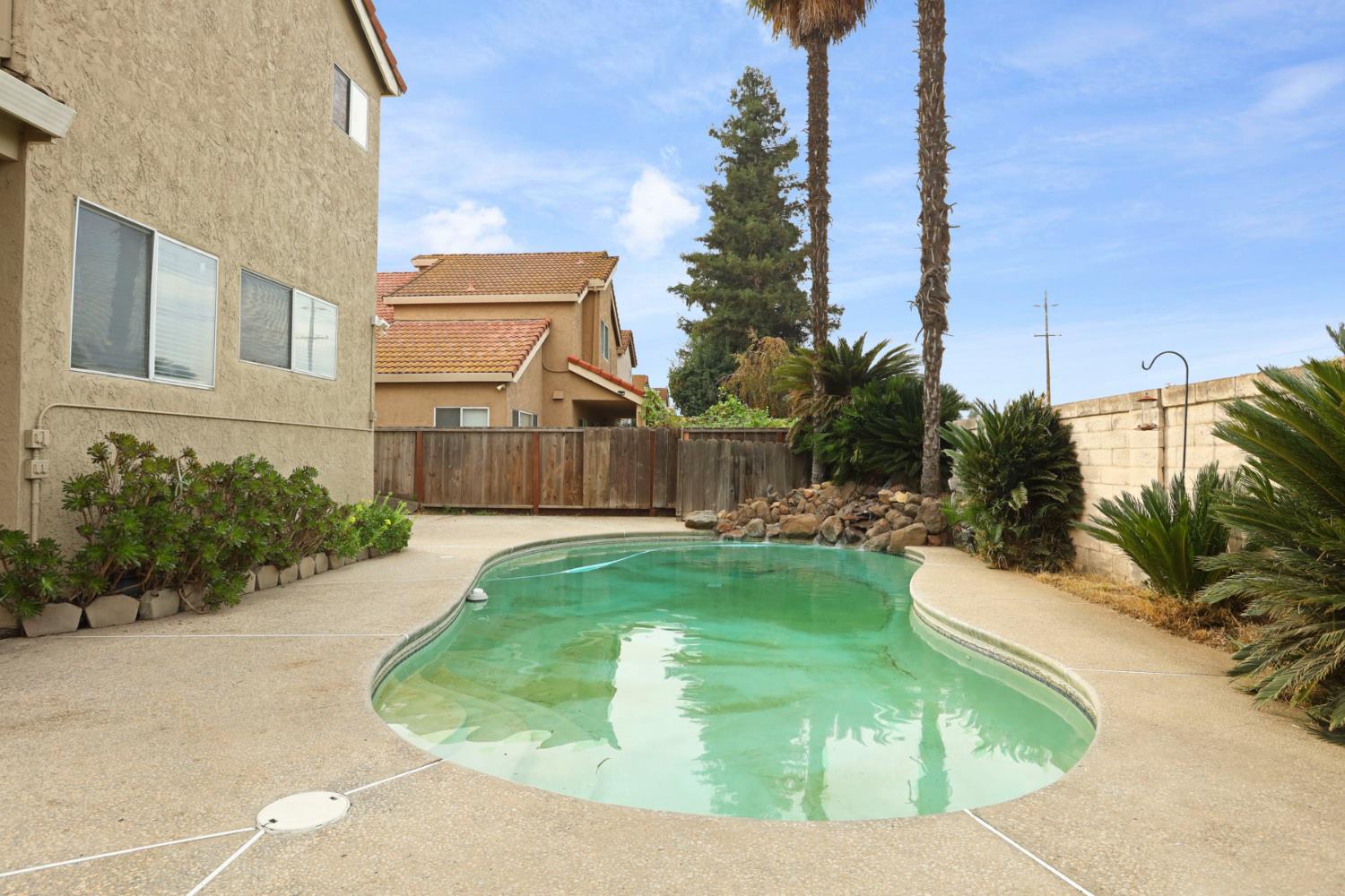 1725 Mark Mead Lane Modesto, CA 95356 - Photo 48 of 52 a view of a house with backyard and sitting area