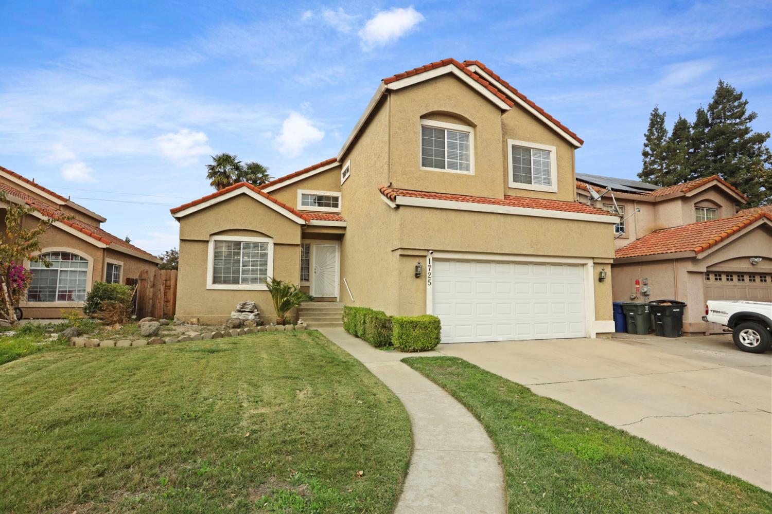 1725 Mark Mead Lane Modesto, CA 95356 - Photo 50 of 52 a front view of a house with a yard