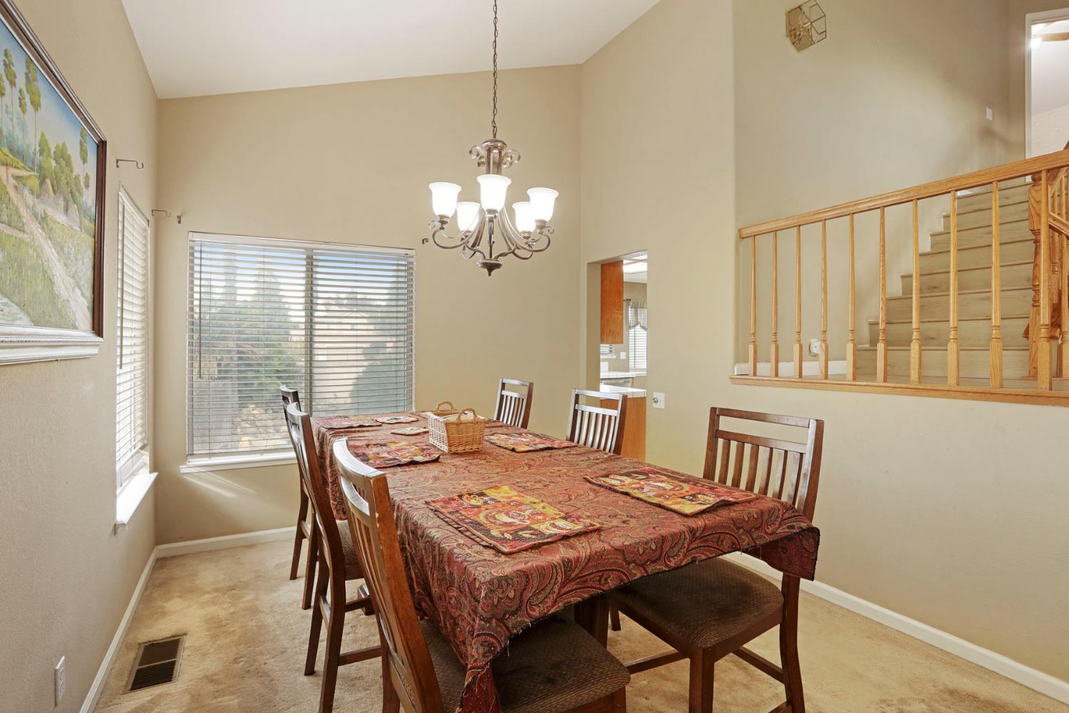 1725 Mark Mead Lane Modesto, CA 95356 - Photo 7 of 52 a view of a dining room with furniture window and outside view