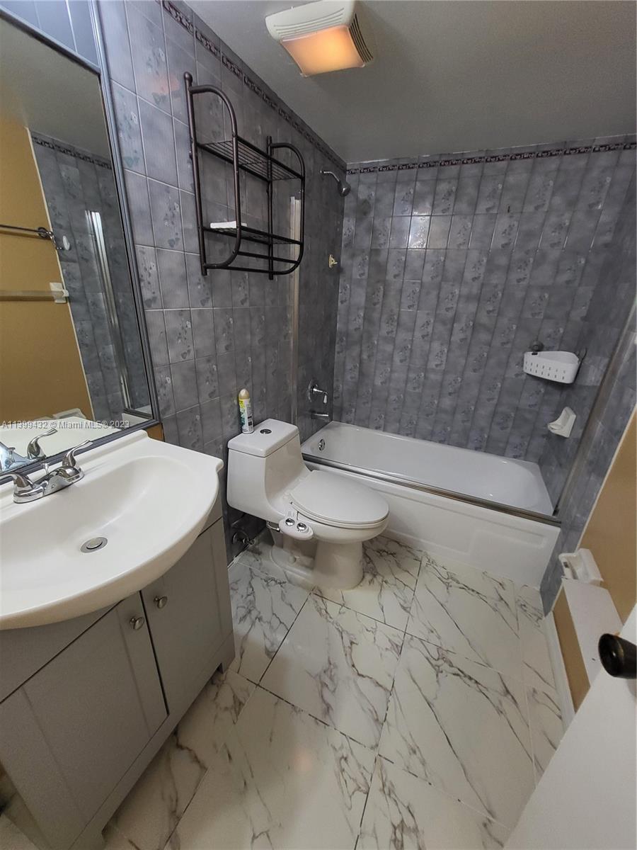 Hialeah Hialeah, FL 33016 - Photo 14 of 14 a bathroom with a sink a toilet and shower