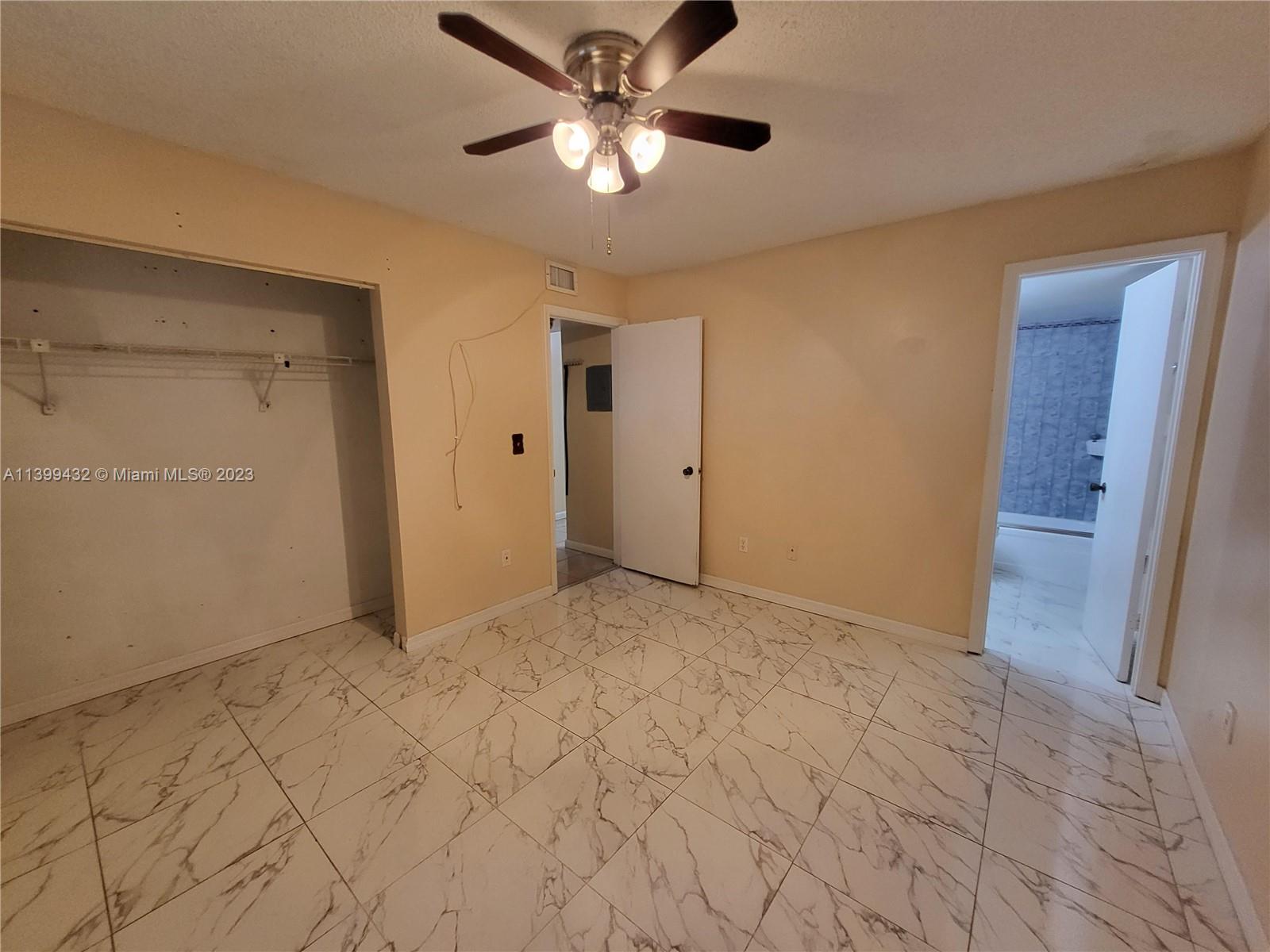 Hialeah Hialeah, FL 33016 - Photo 8 of 14 a view of an empty room and chandelier fan