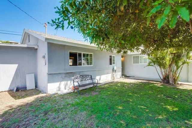 a house view with a sitting space and garden