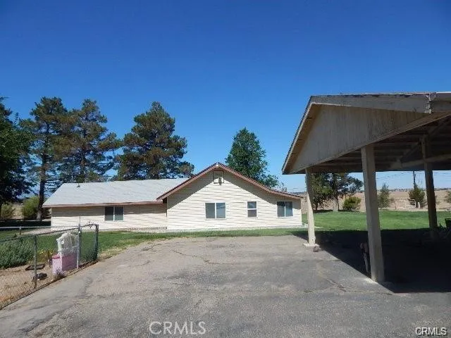 a house with trees in the background