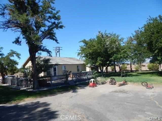 19968 Bear Valley Road Apple Valley, CA 92308 - Photo 3 of 20 a view of outdoor space with garden and trees