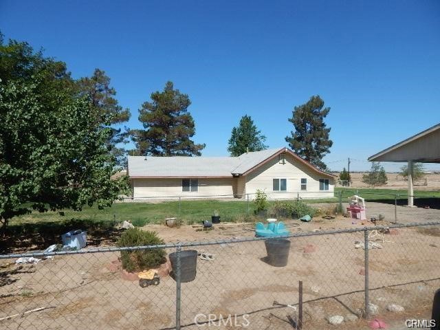 19968 Bear Valley Road Apple Valley, CA 92308 - Photo 4 of 20 a view of a house with backyard and sitting area