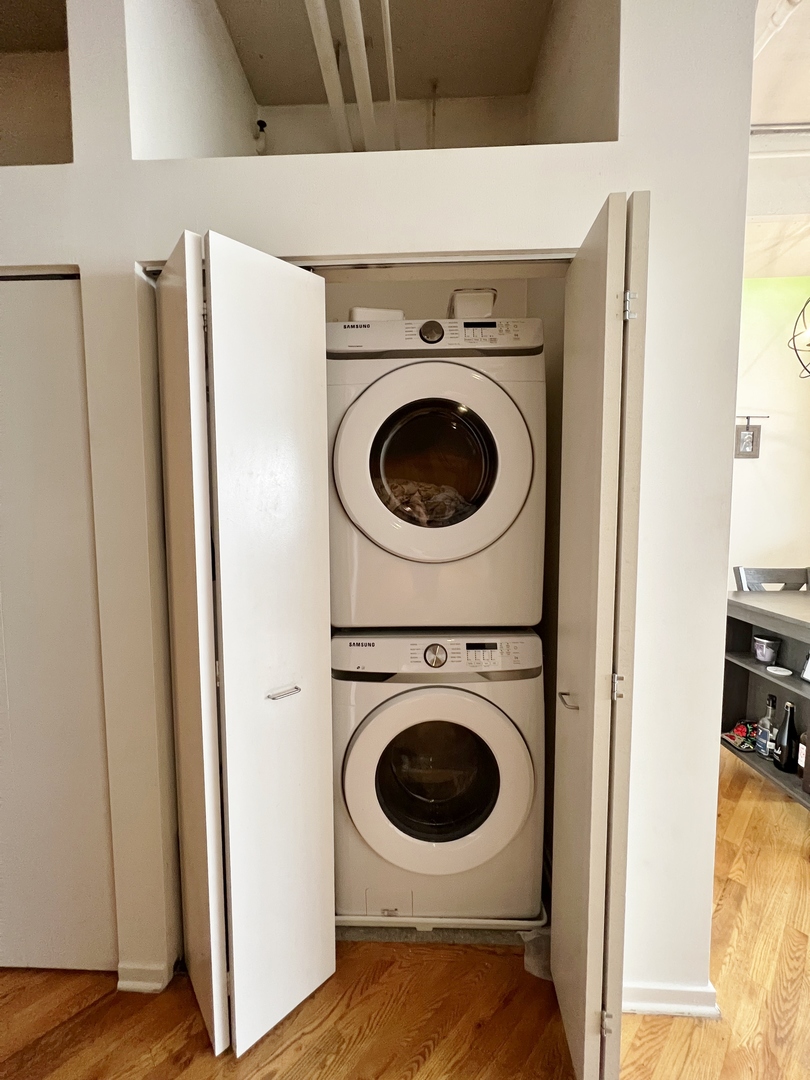 500 South Clinton Street, Unit 720 Chicago, IL 60607 - Photo 13 of 19 a view of a storage & utility room with washer and dryer