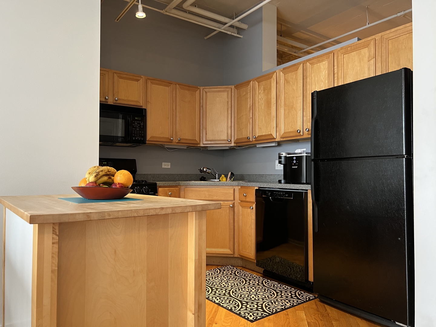 500 South Clinton Street, Unit 720 Chicago, IL 60607 - Photo 3 of 19 a kitchen with stainless steel appliances a refrigerator and a stove