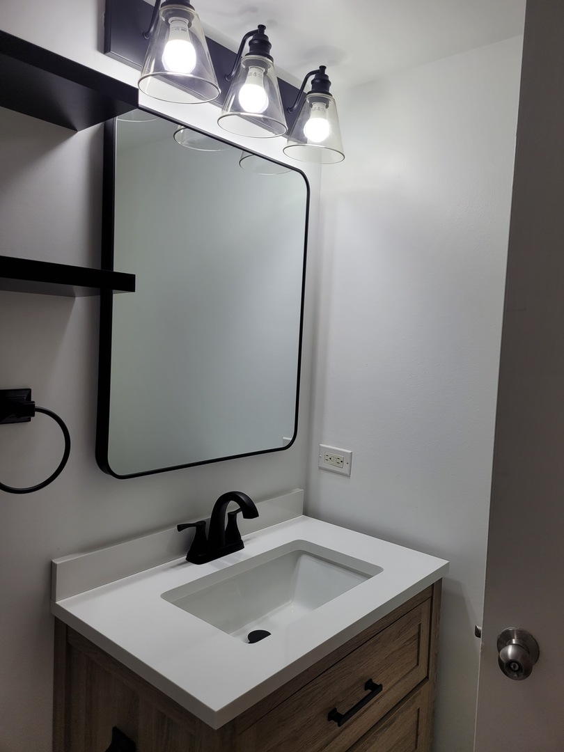 500 South Clinton Street, Unit 720 Chicago, IL 60607 - Photo 10 of 19 a bathroom with a sink and a mirror