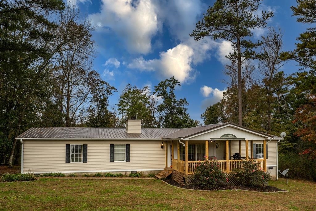 366 Lowell Allen Road Waco, GA 30182 - Photo 1 of 1 a front view of a house with a garden