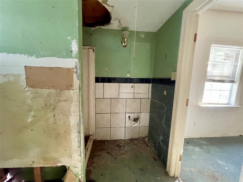 502 North Kramer Street Dallas, TX 75211 - Photo 12 of 19 view of a bathroom with a sink and a shower