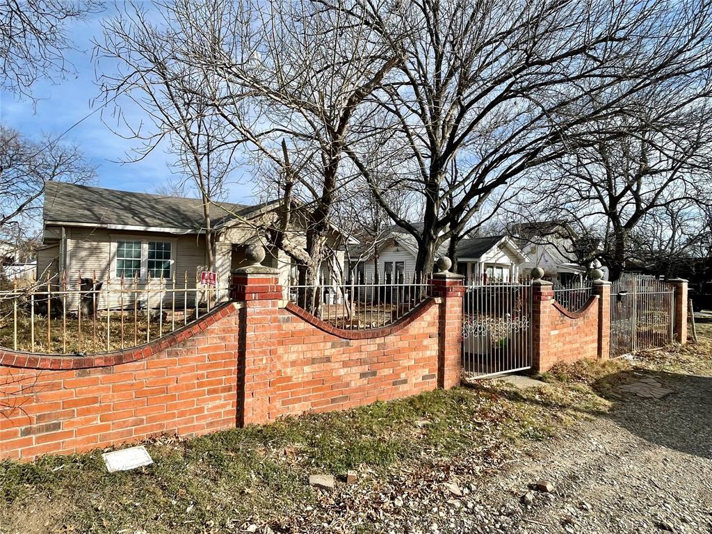 502 North Kramer Street Dallas, TX 75211 - Photo 2 of 19 a view of a house with snow on the road