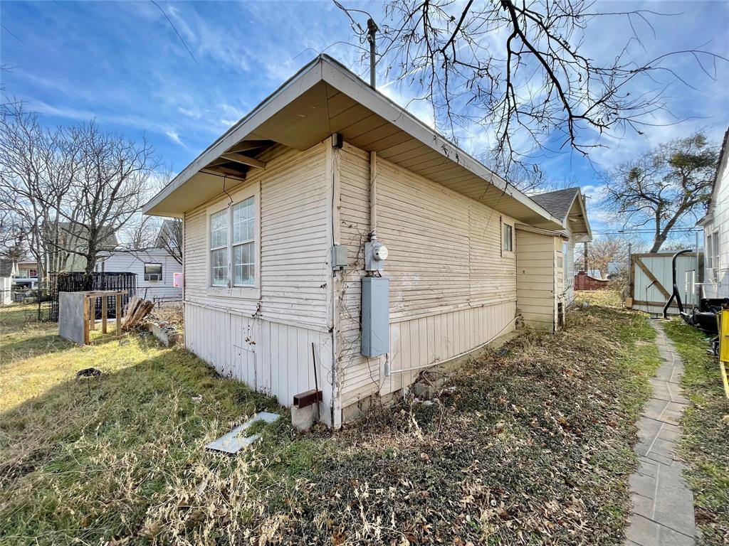 502 North Kramer Street Dallas, TX 75211 - Photo 7 of 19 a view of a house with a yard
