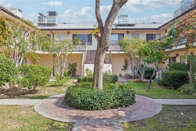 a view of a garden in front of a house