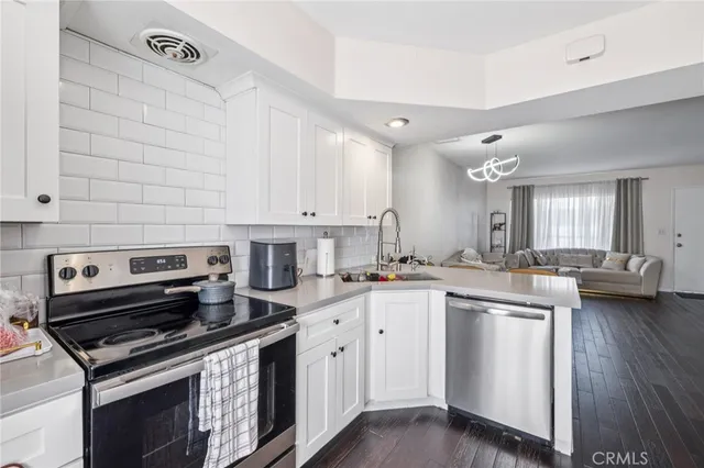 a kitchen with a stove and a sink