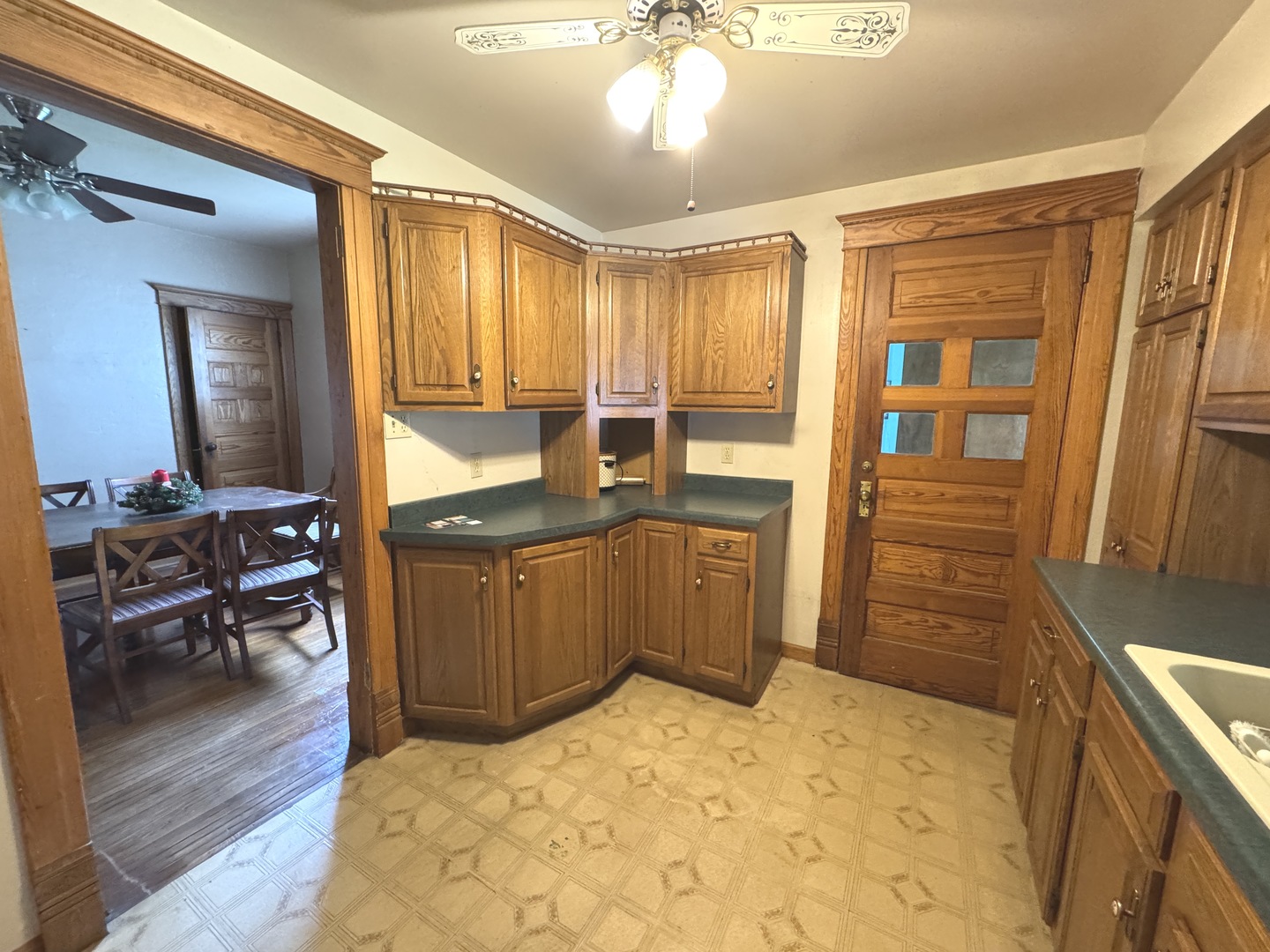 428 West Cherry Street Compton, IL 61318 - Photo 12 of 20 a kitchen with sink cabinets and wooden floor