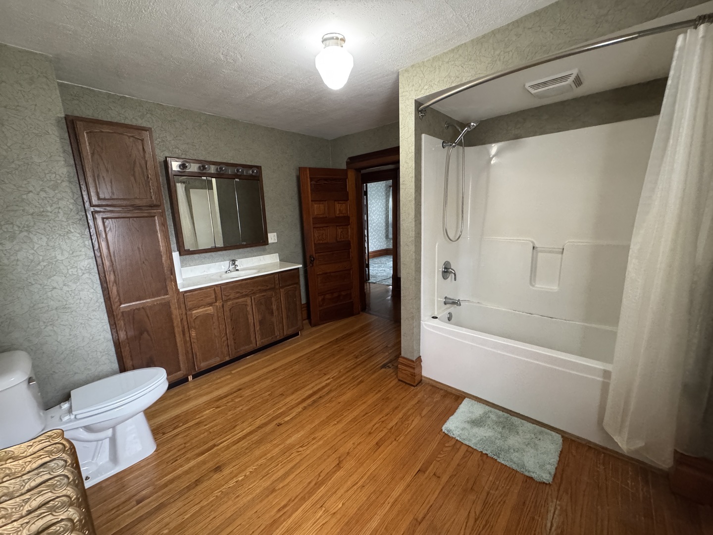 428 West Cherry Street Compton, IL 61318 - Photo 18 of 20 a bathroom with a tub shower and toilet