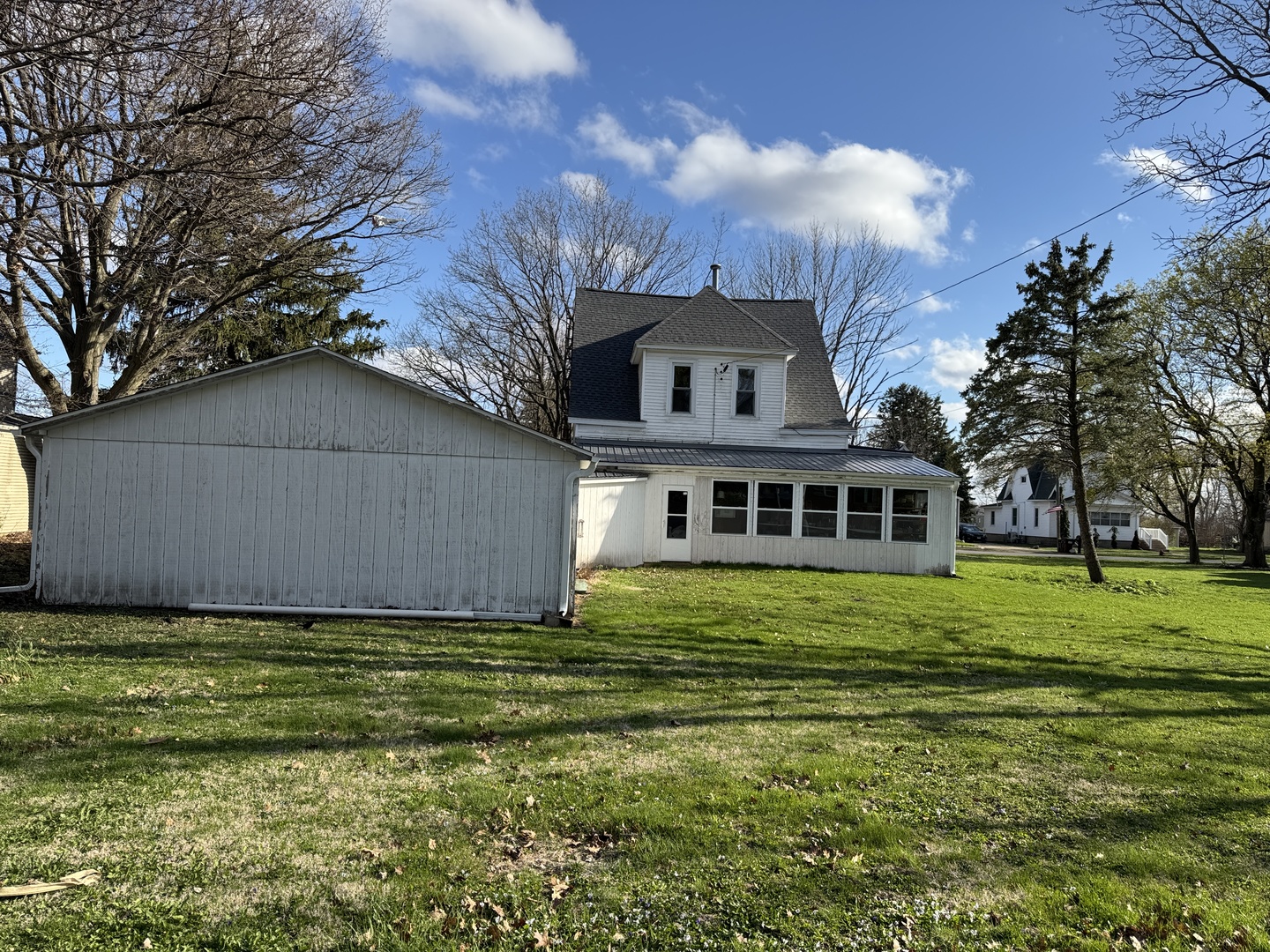 428 West Cherry Street Compton, IL 61318 - Photo 2 of 20 a white house with a big yard and large trees