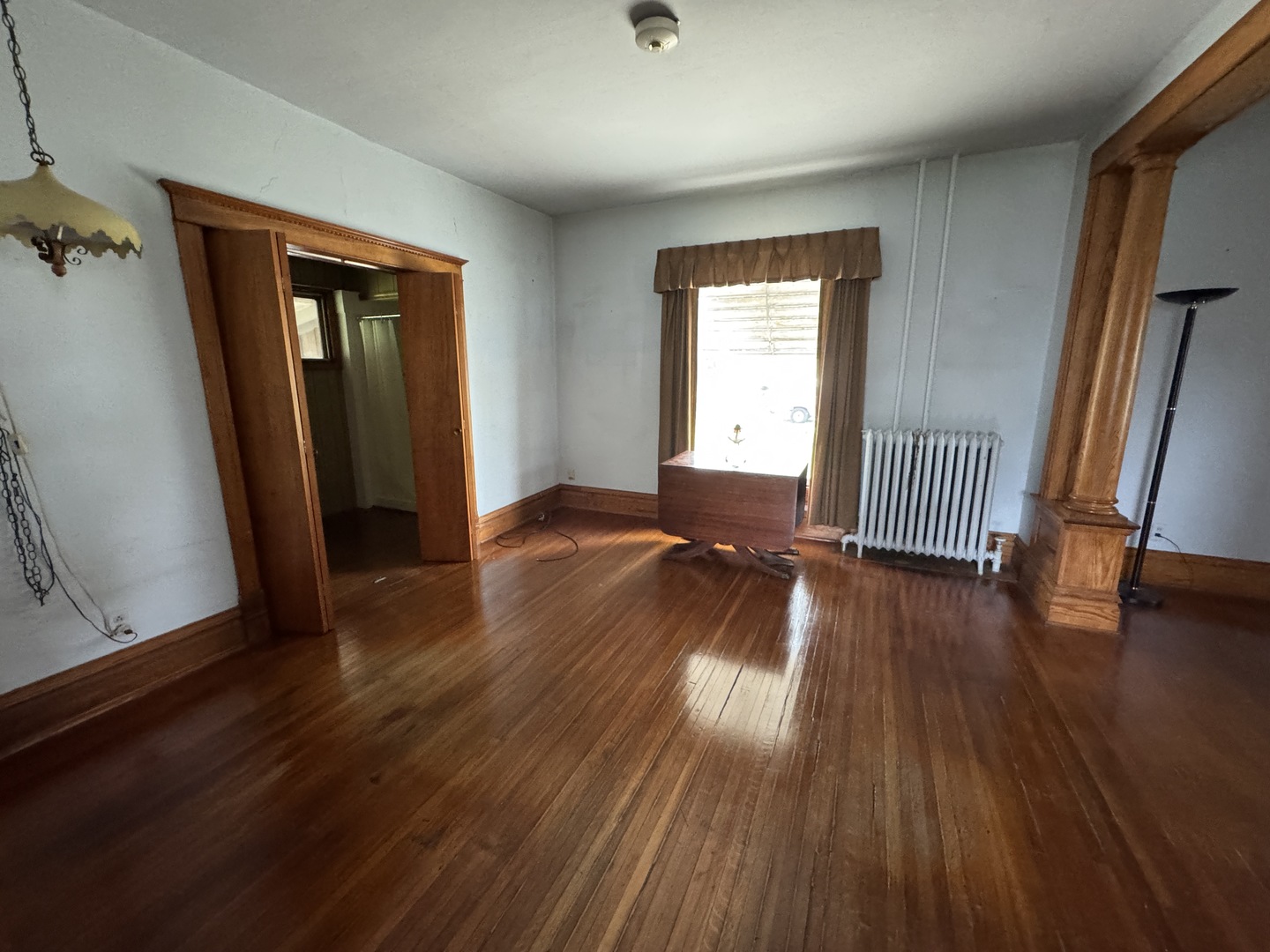 428 West Cherry Street Compton, IL 61318 - Photo 7 of 20 an empty room with wooden floor and windows