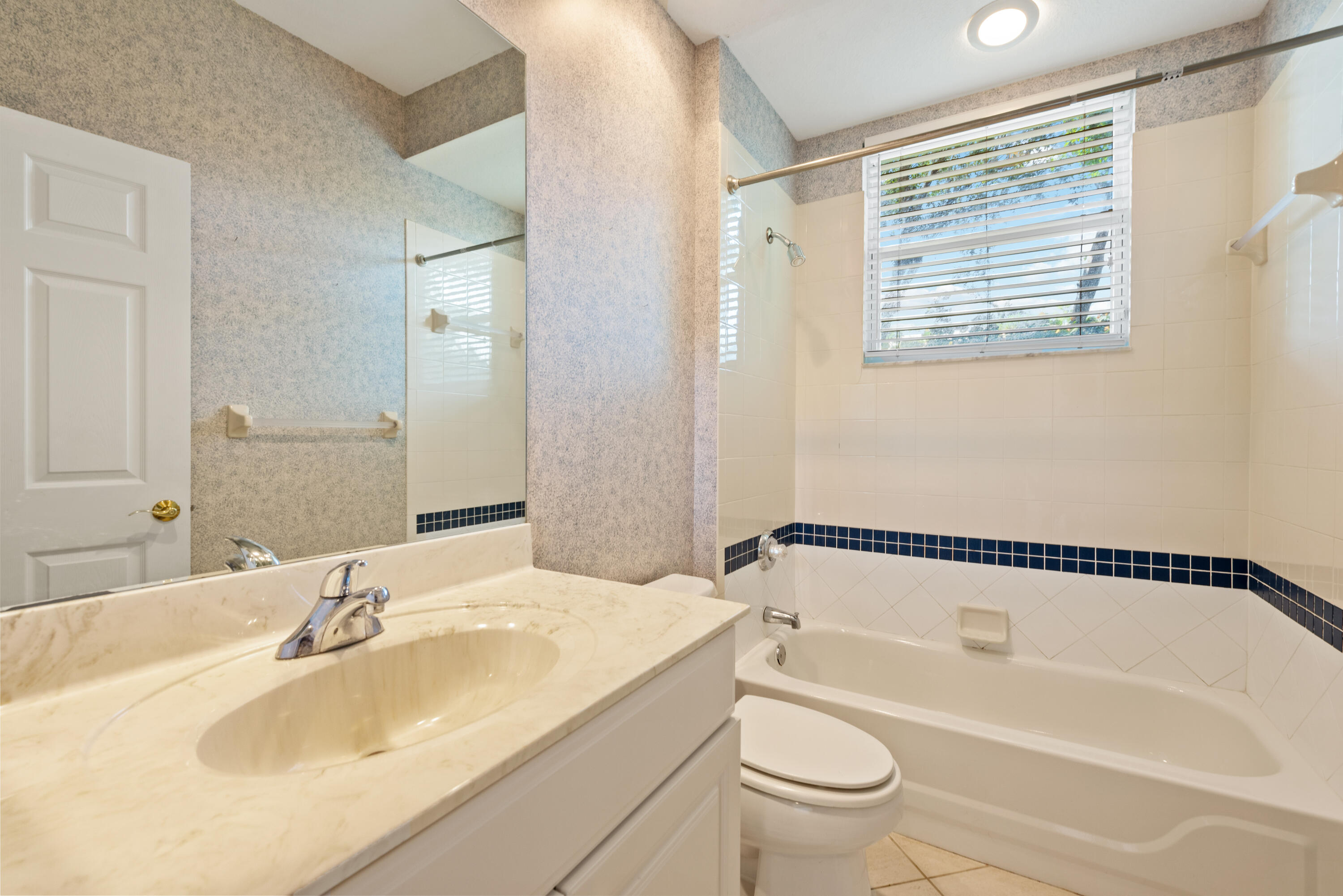8525 Peppertree Way Naples, FL 34114 - Photo 17 of 47 a bathroom with a sink a toilet and a bathtub