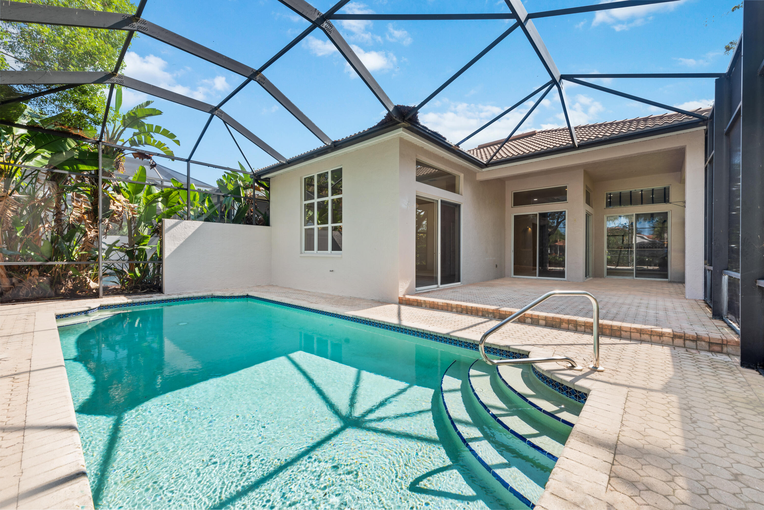 8525 Peppertree Way Naples, FL 34114 - Photo 21 of 47 a backyard of a house with table and chairs