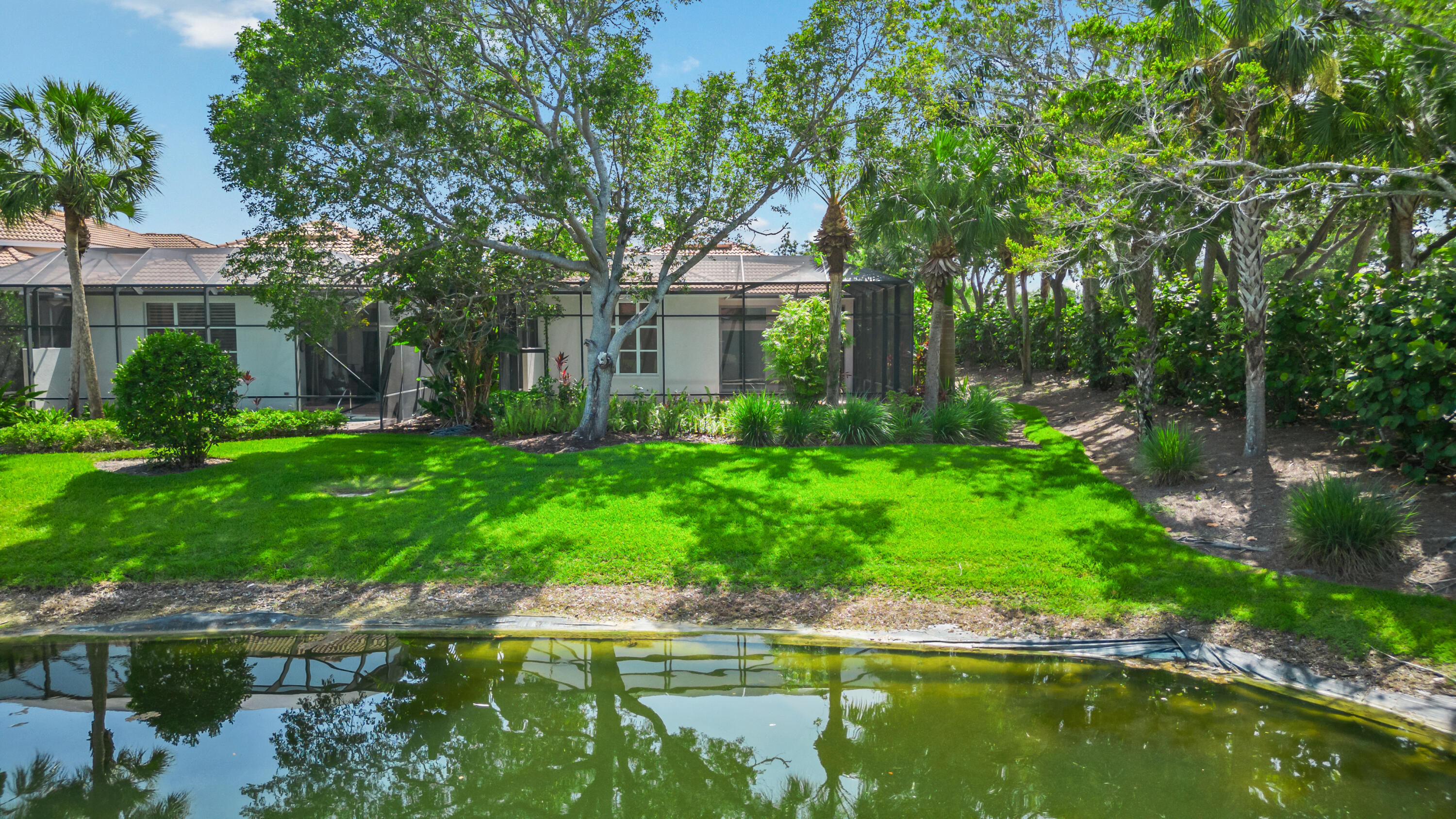 8525 Peppertree Way Naples, FL 34114 - Photo 29 of 47 a backyard of a house with lots of green space and lake view