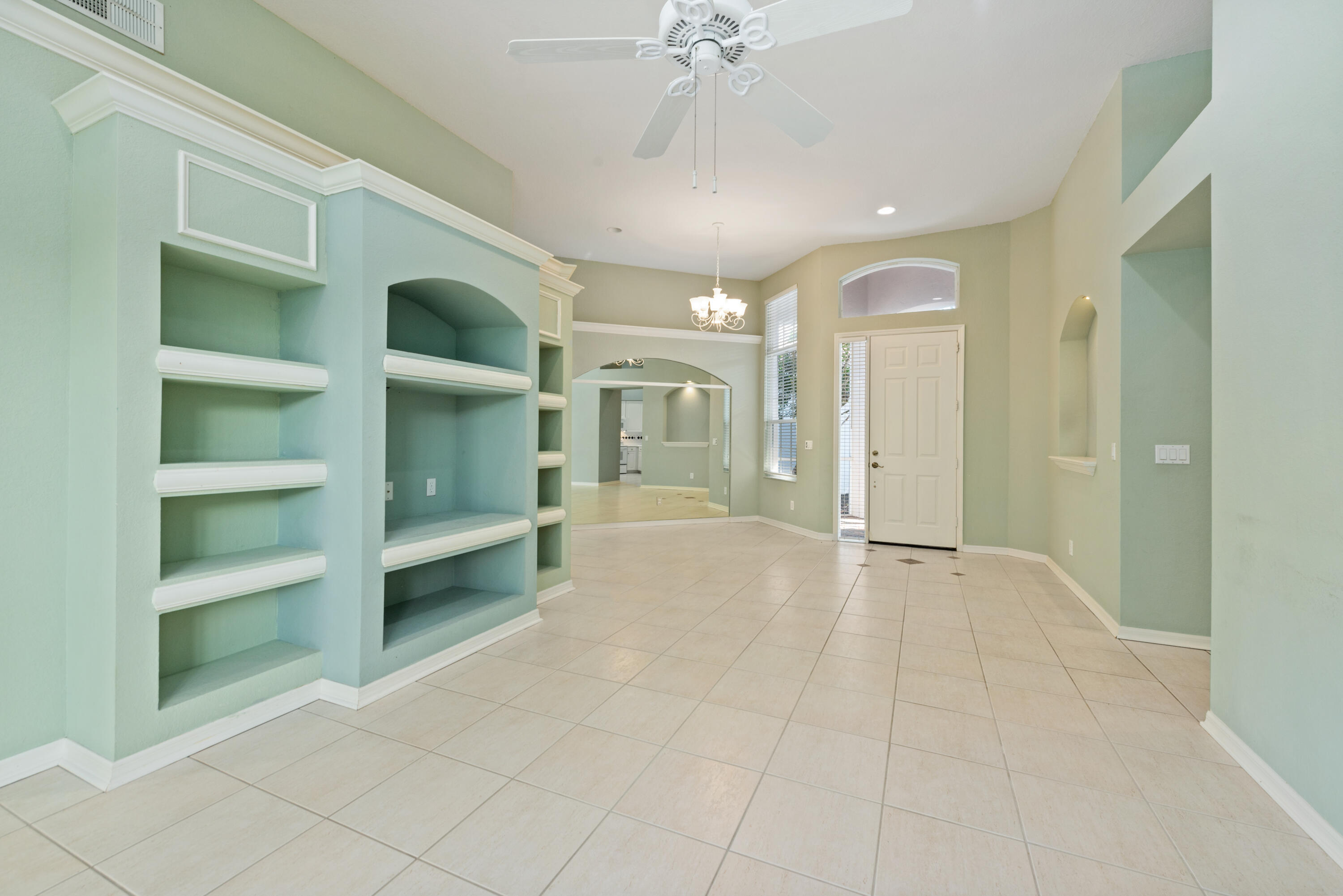 8525 Peppertree Way Naples, FL 34114 - Photo 4 of 47 a view of an empty room with a cabinet