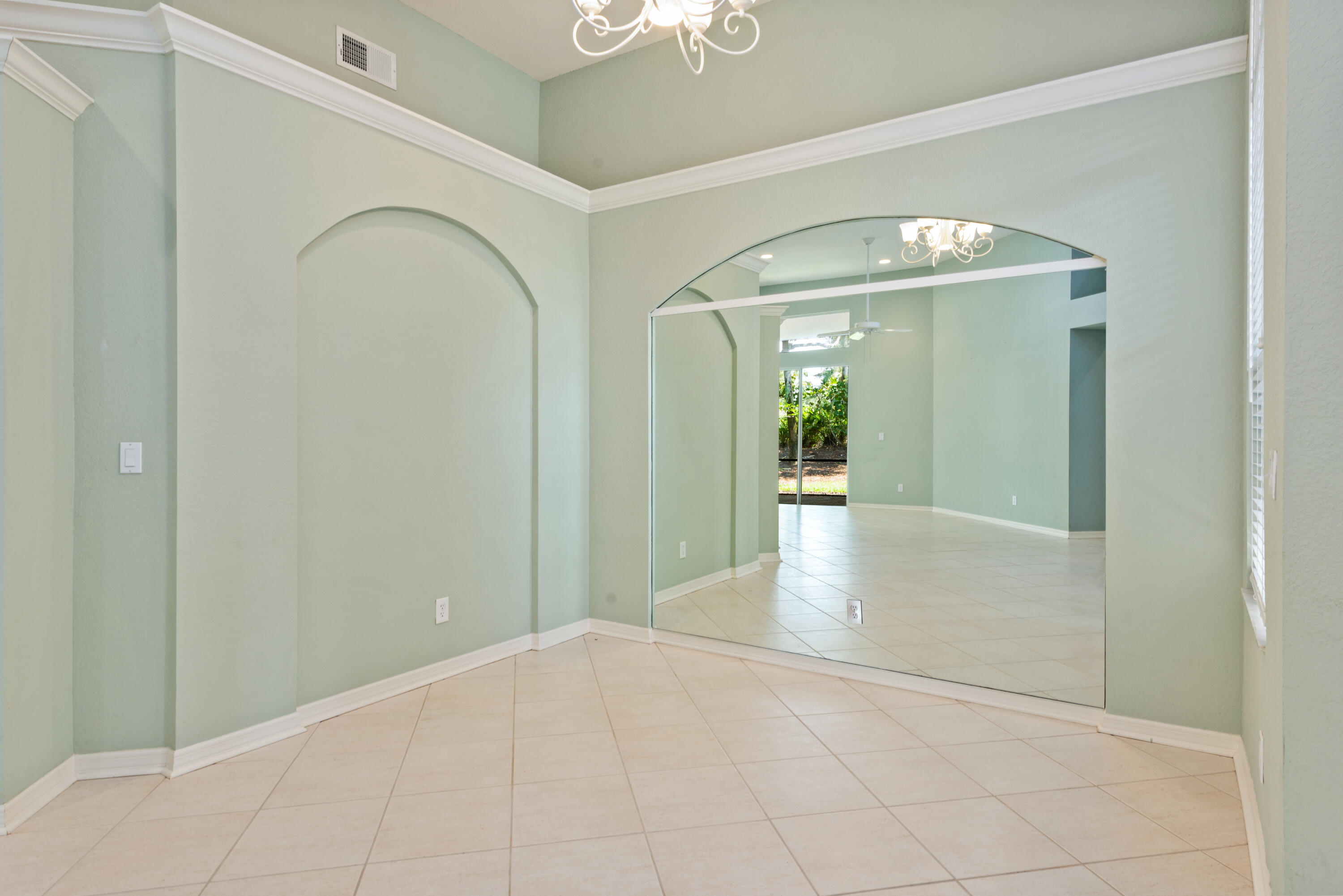 8525 Peppertree Way Naples, FL 34114 - Photo 9 of 47 a view of an entryway with wooden floor