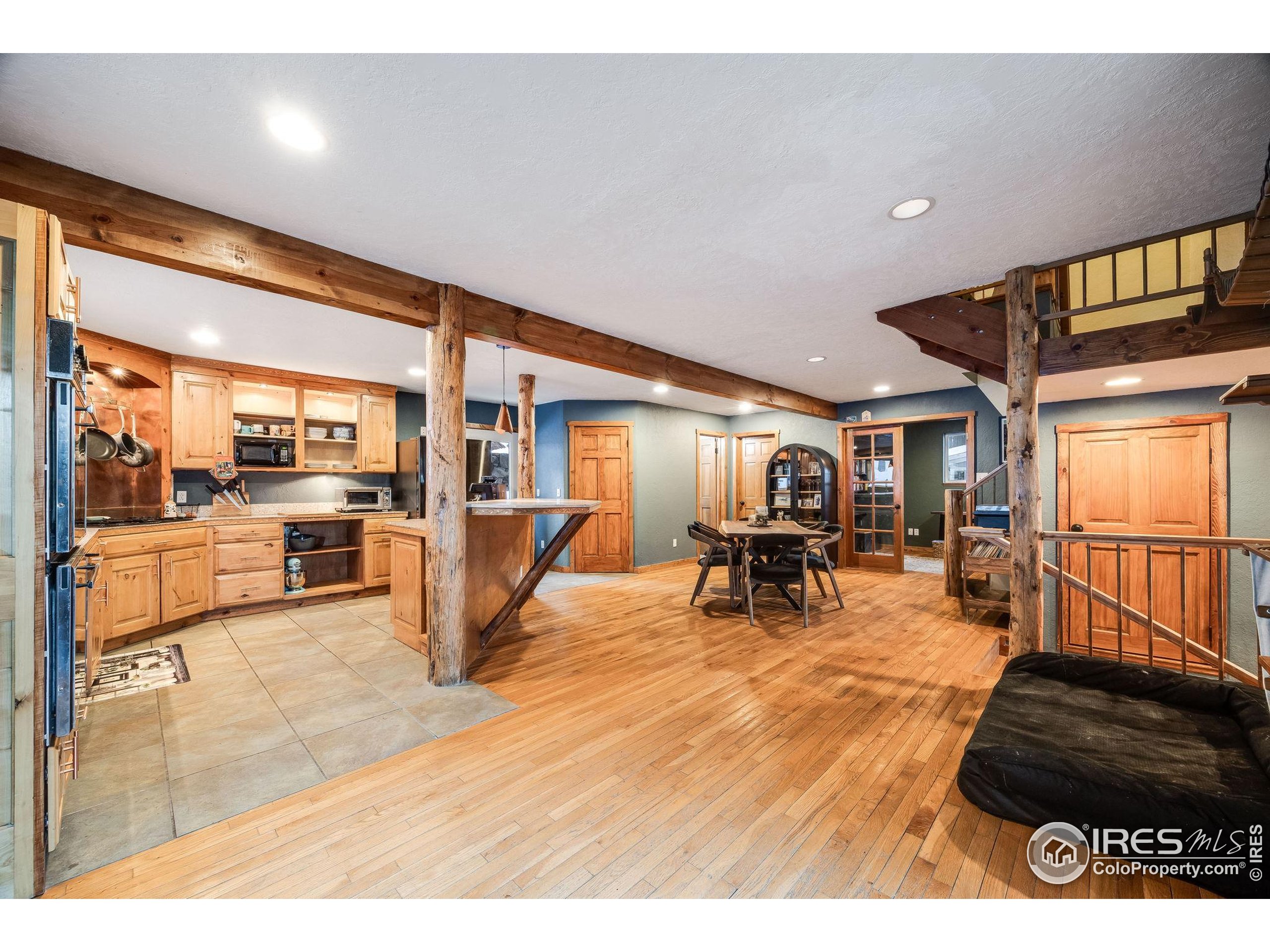 46 Apache Road Evergreen, CO 80439 - Photo 11 of 39 a living room with furniture and a table