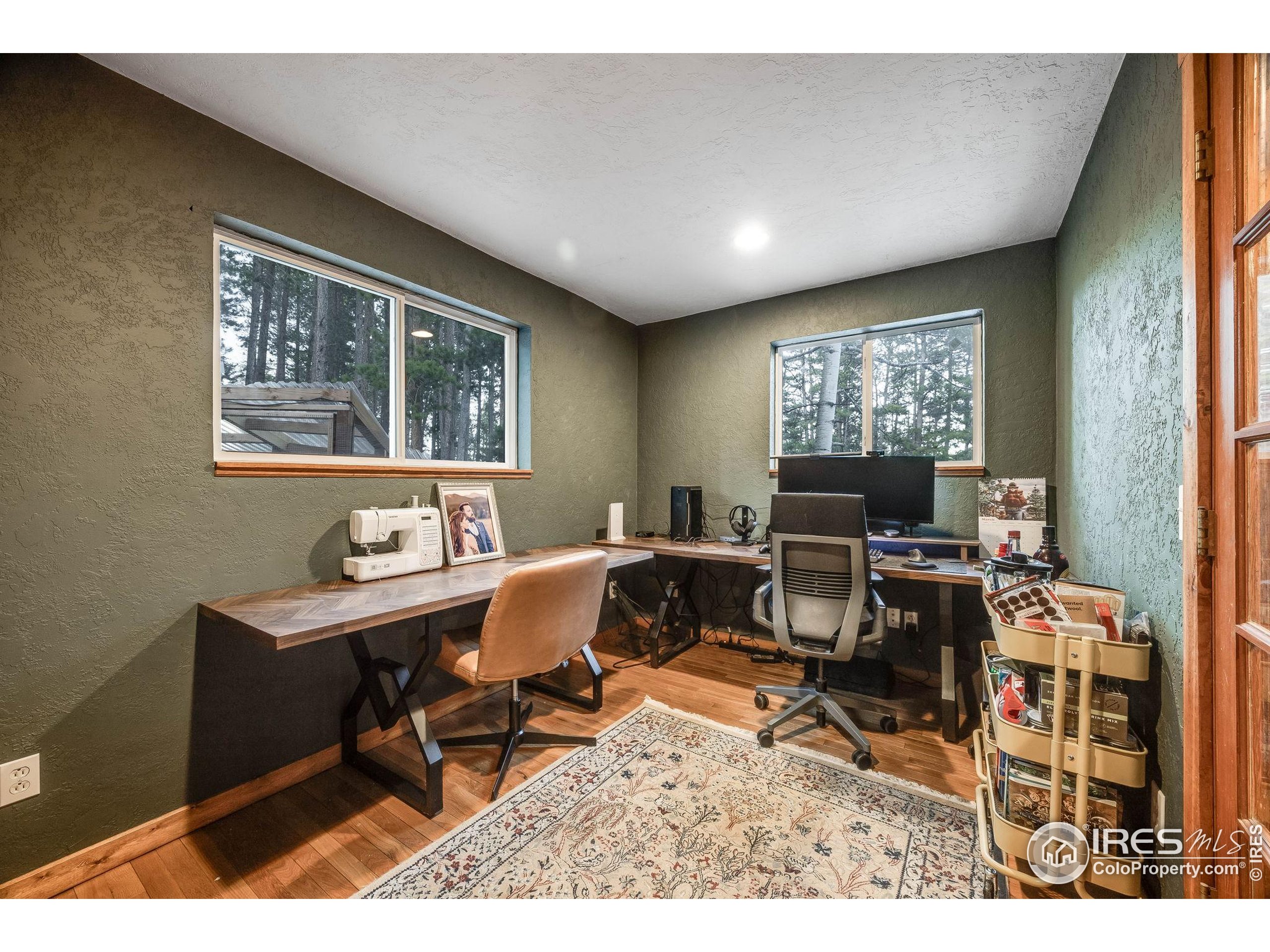 46 Apache Road Evergreen, CO 80439 - Photo 18 of 39 a workspace with furniture and a window