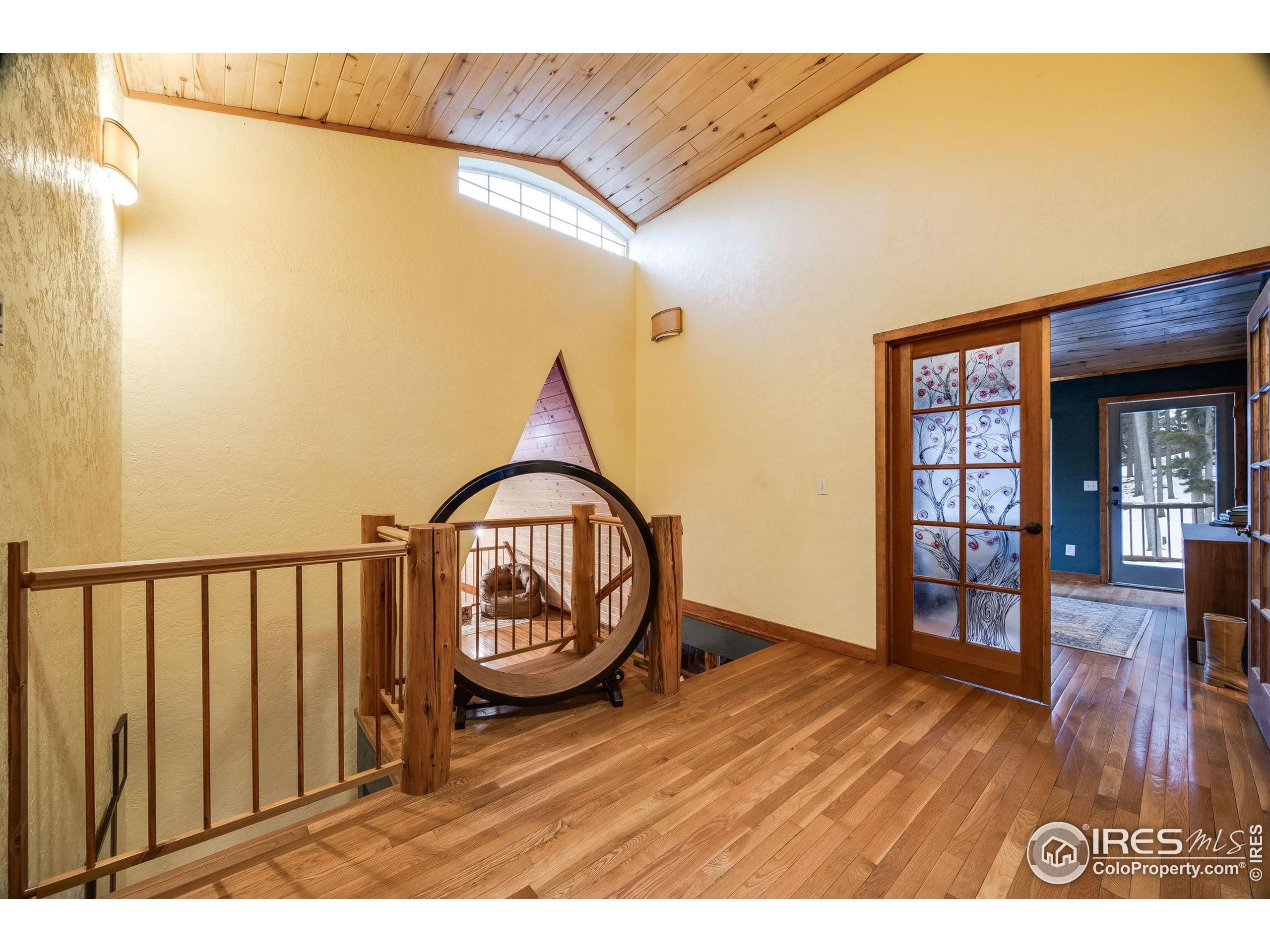 46 Apache Road Evergreen, CO 80439 - Photo 20 of 39 a view of entryway with wooden floor
