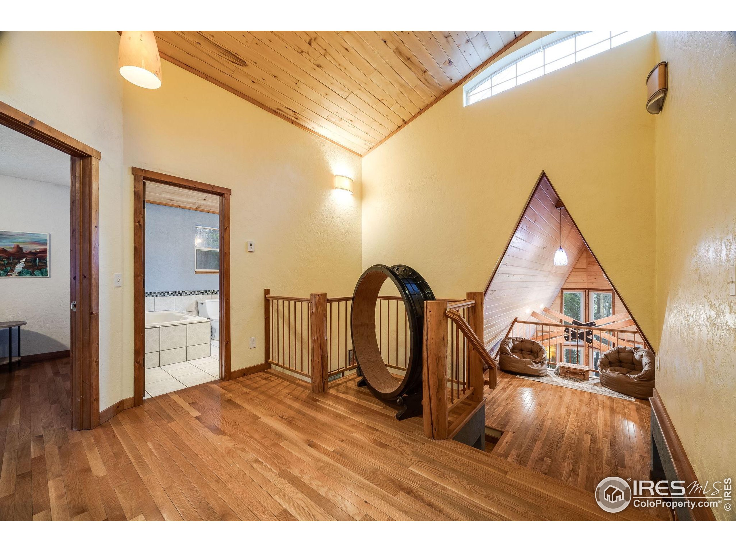46 Apache Road Evergreen, CO 80439 - Photo 21 of 39 a view of an entryway with wooden floor
