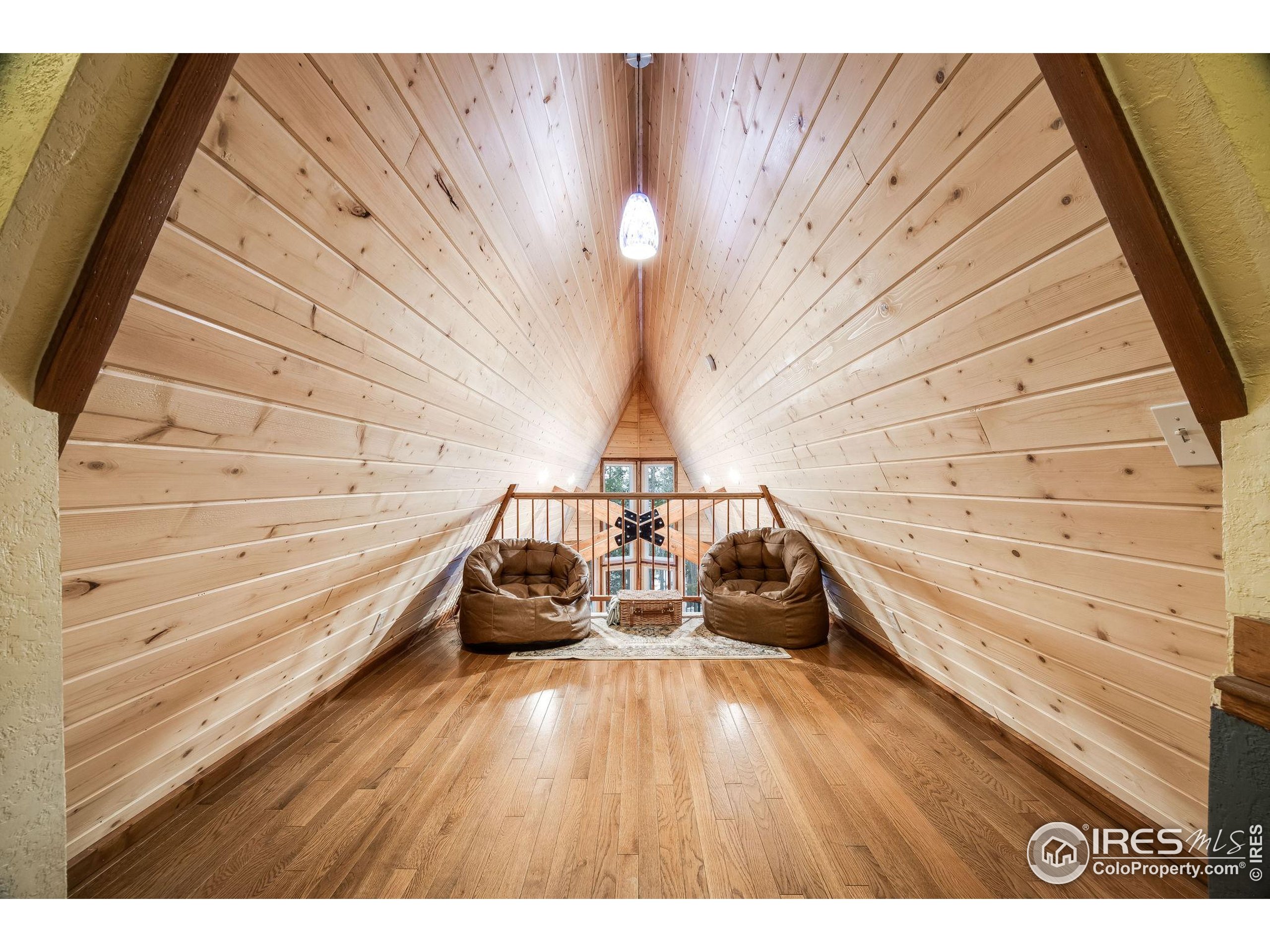 46 Apache Road Evergreen, CO 80439 - Photo 22 of 39 a view of a room with wooden floor