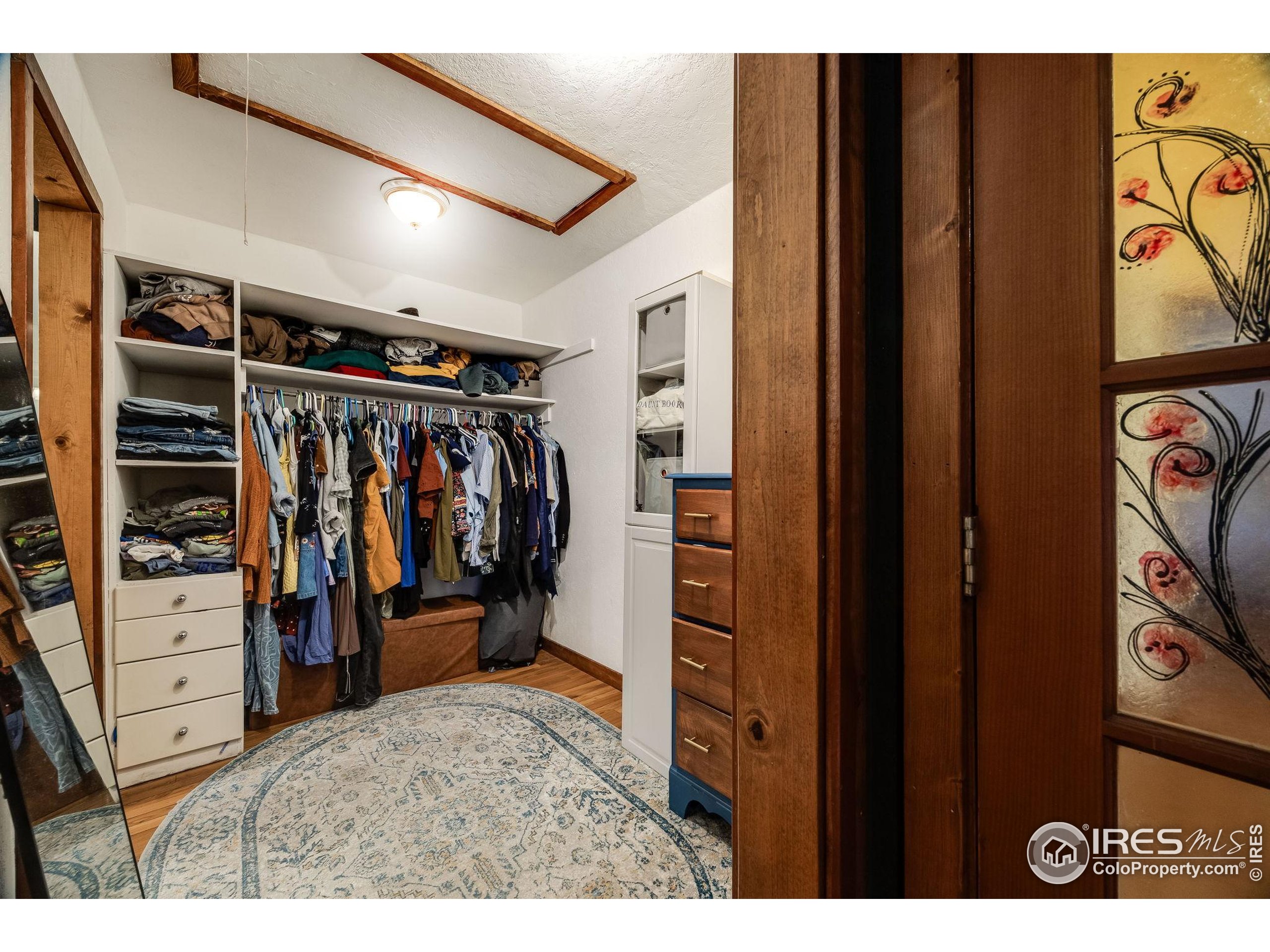 46 Apache Road Evergreen, CO 80439 - Photo 26 of 39 a view of walk in closet with clothes and shoes