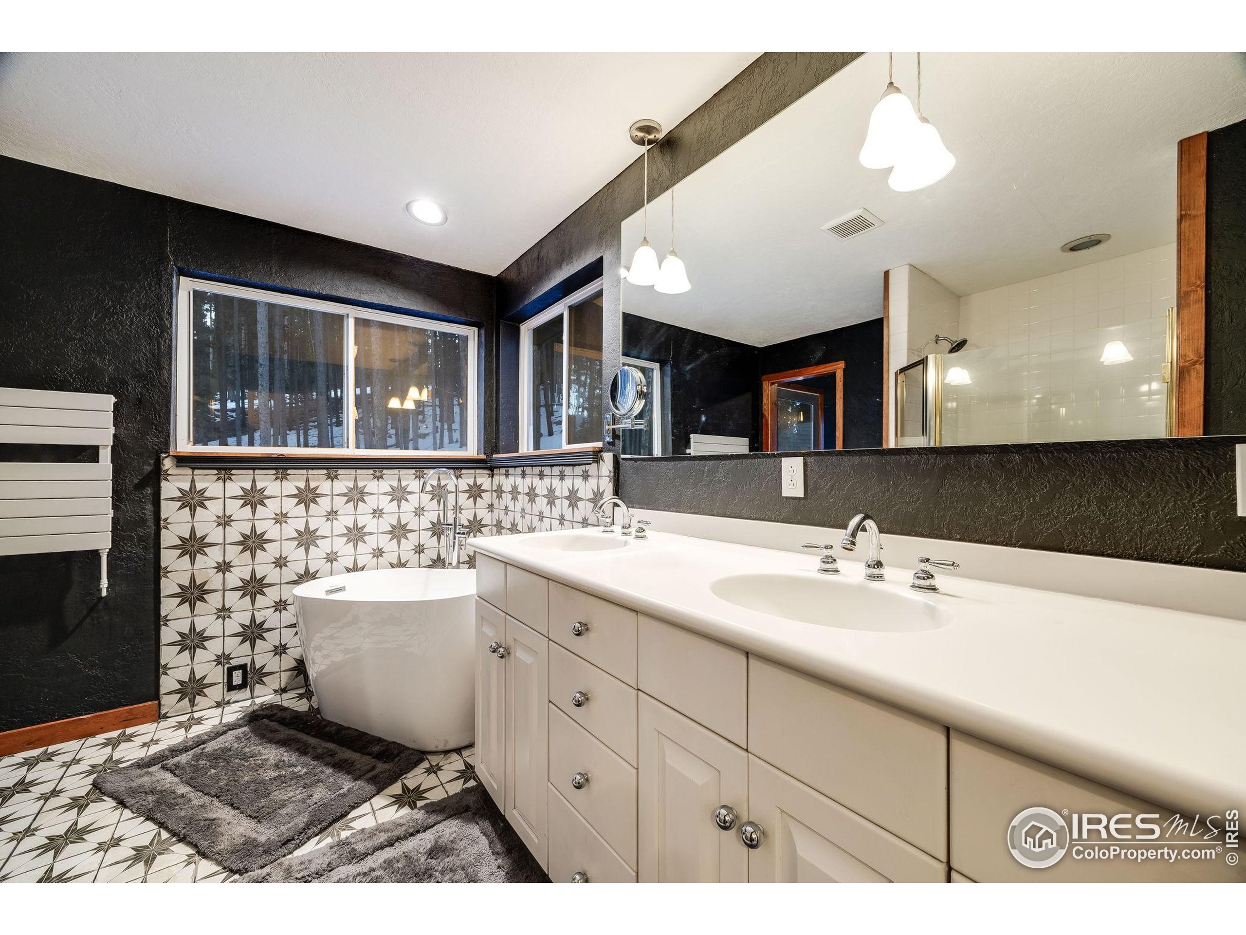 46 Apache Road Evergreen, CO 80439 - Photo 28 of 39 a bathroom with a sink toilet and mirror