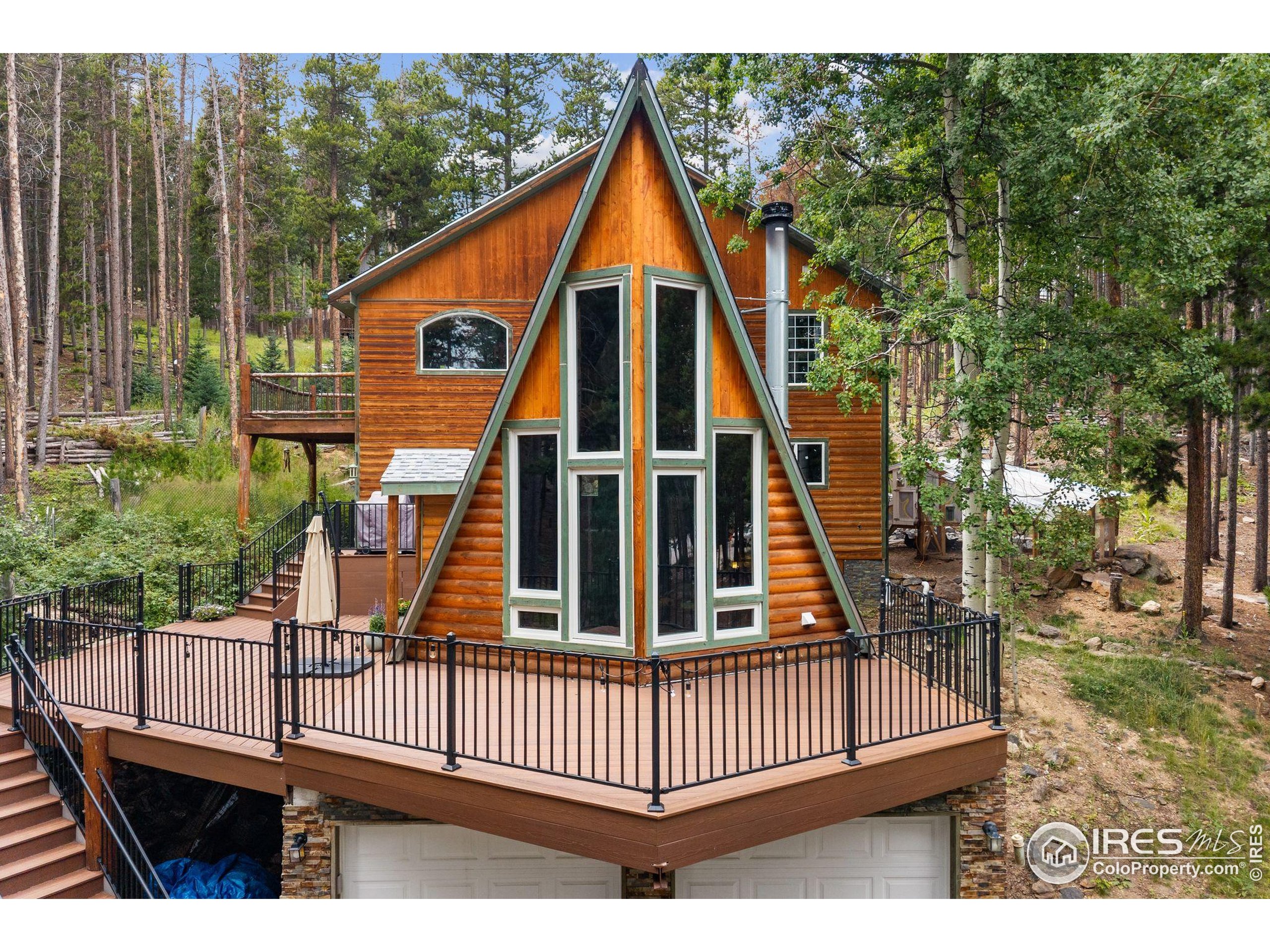 46 Apache Road Evergreen, CO 80439 - Photo 3 of 39 a view of backyard of house