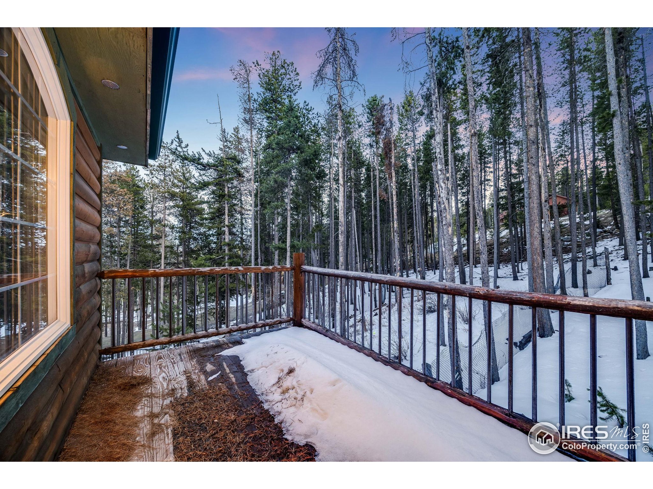 46 Apache Road Evergreen, CO 80439 - Photo 31 of 39 a balcony with wooden floor