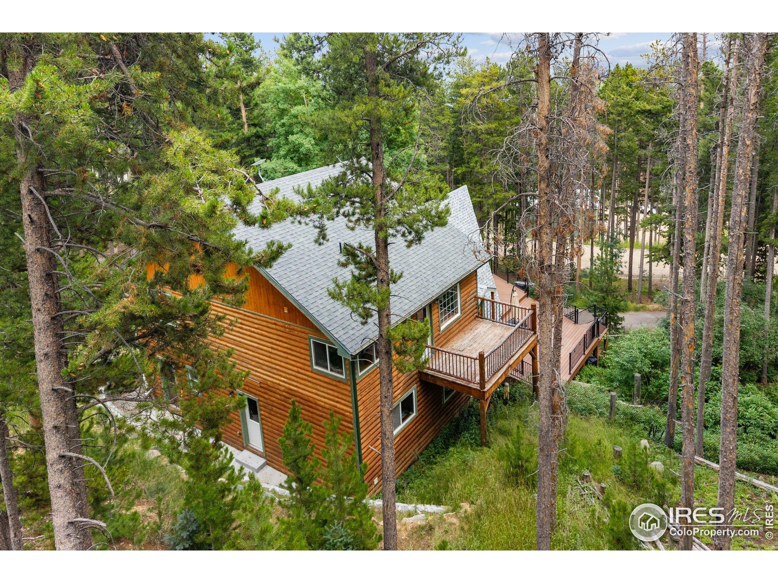 46 Apache Road Evergreen, CO 80439 - Photo 34 of 39 a aerial view of a house with a yard