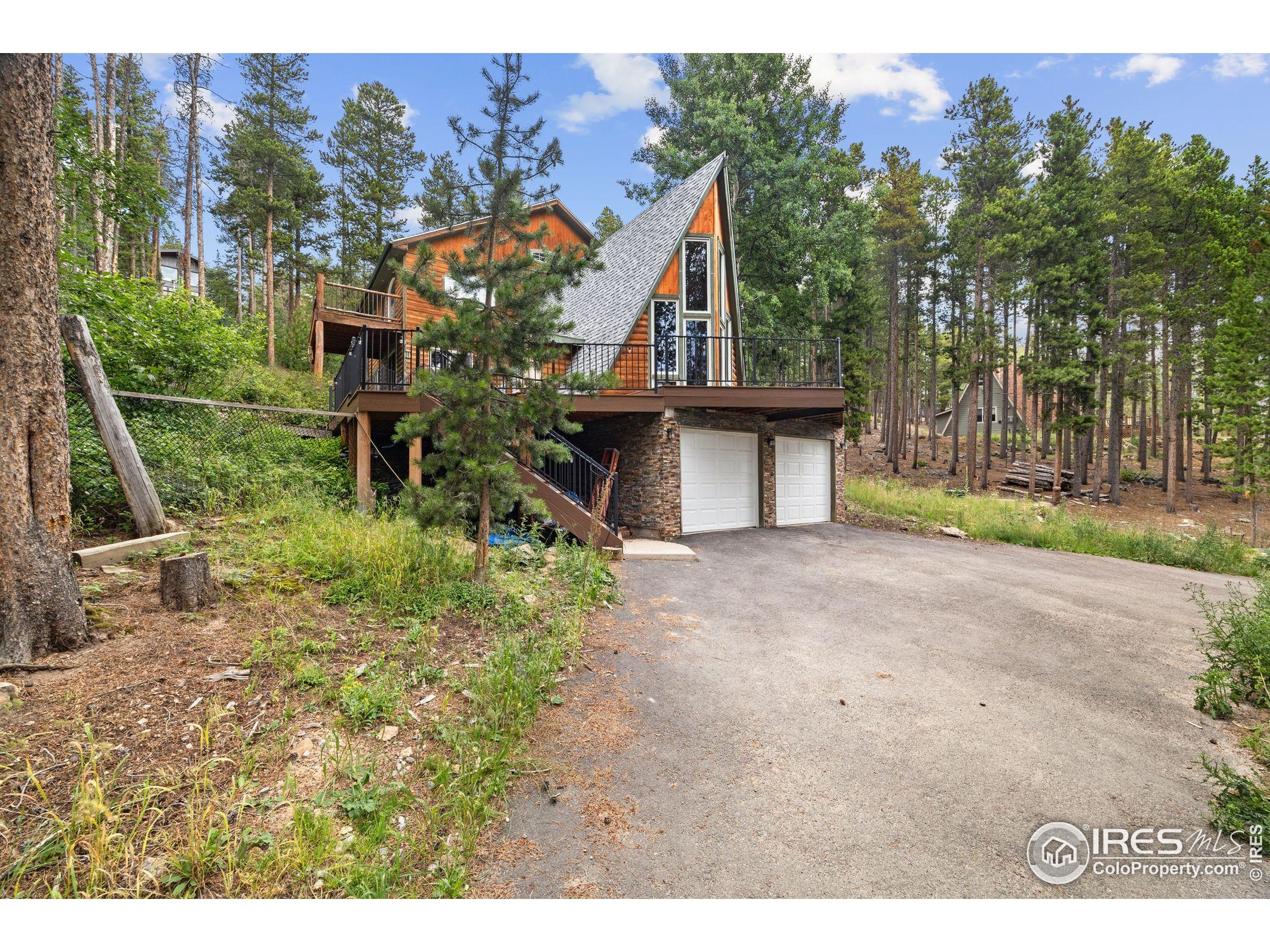 46 Apache Road Evergreen, CO 80439 - Photo 37 of 39 a view of a house with a yard