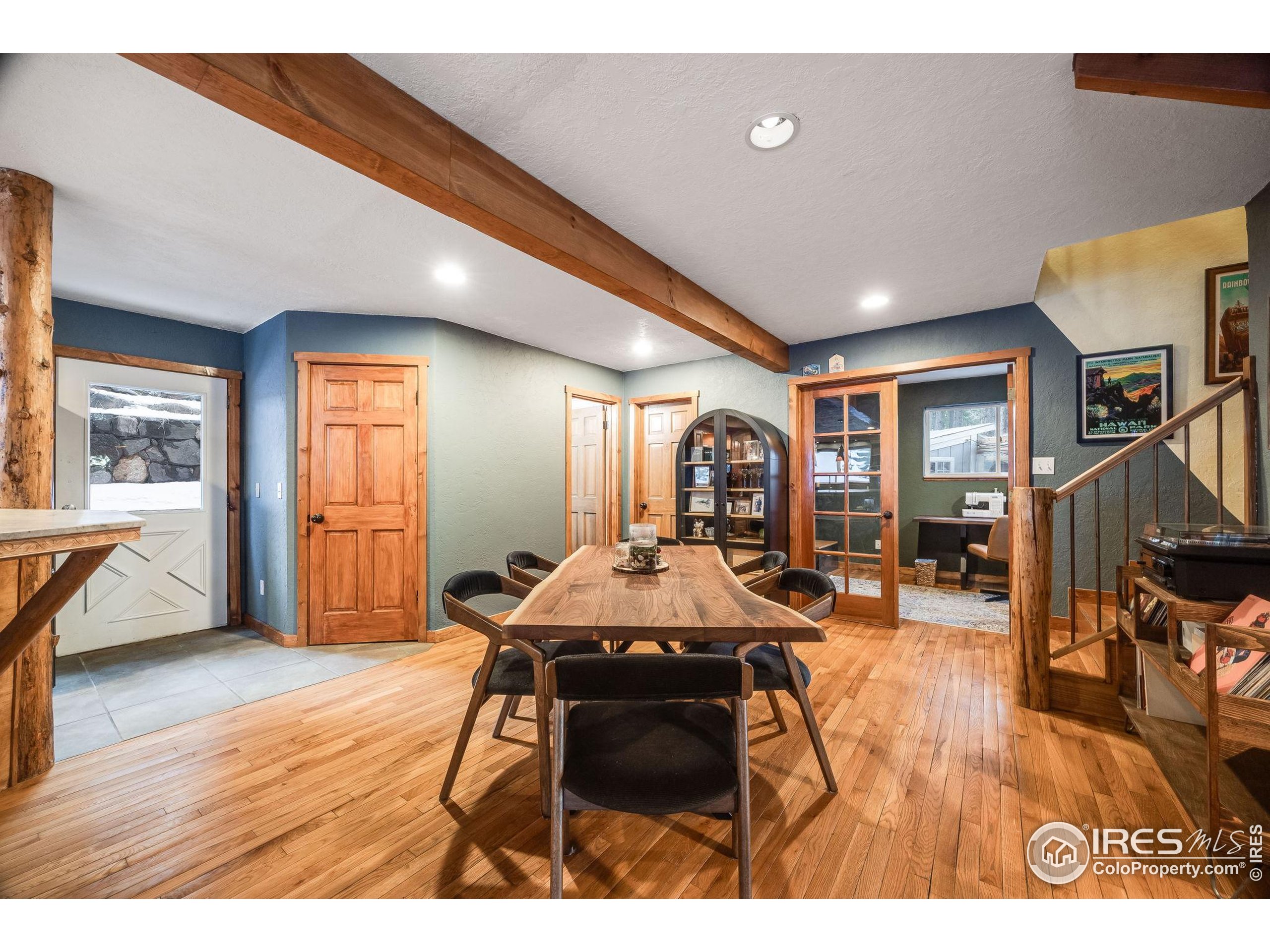46 Apache Road Evergreen, CO 80439 - Photo 9 of 39 a living room with furniture a dining table and wooden floor