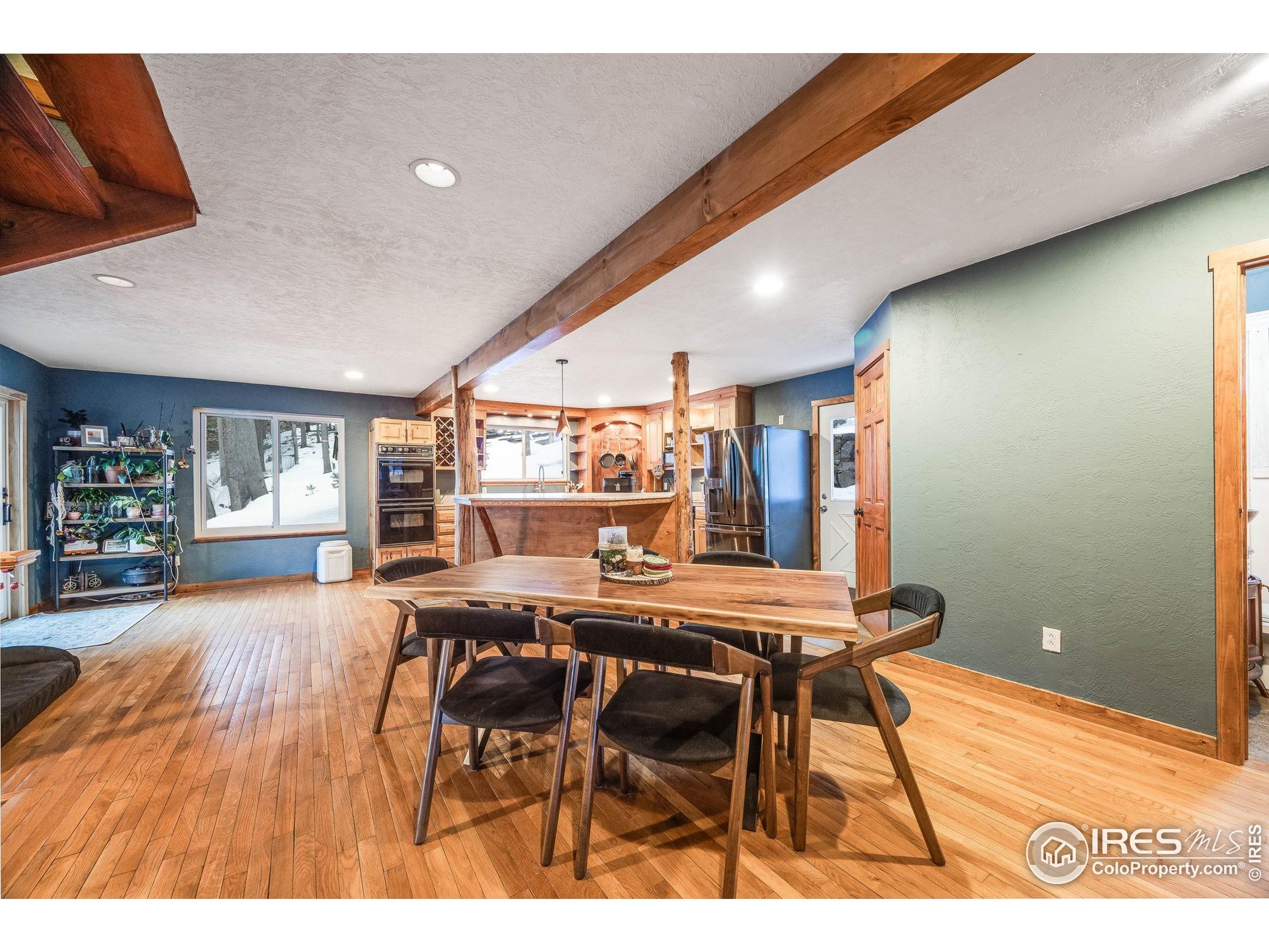46 Apache Road Evergreen, CO 80439 - Photo 10 of 39 a dining room with furniture and window