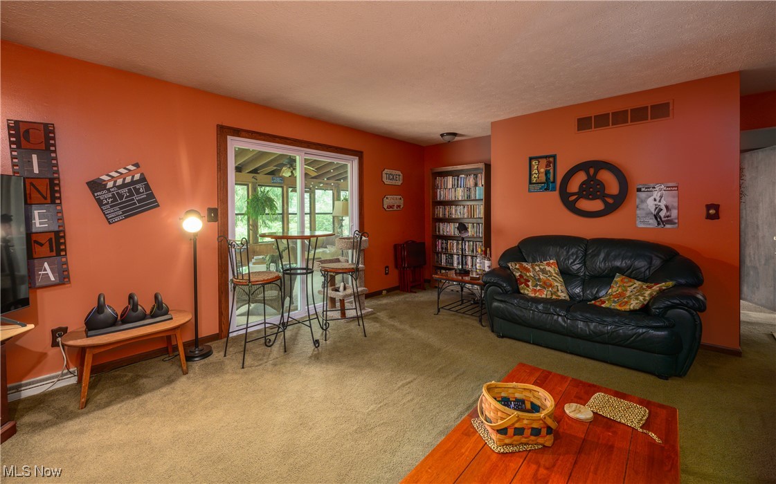 2667 Deibel Road Clinton, OH 44216 - Photo 19 of 23 Living room featuring carpet flooring and a textured ceiling